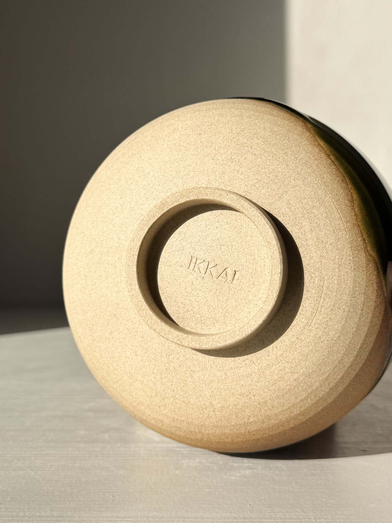 Bottom view of the Matcha Bowl with Spout – Mori #02 showing handmade ceramic detailing and signature.