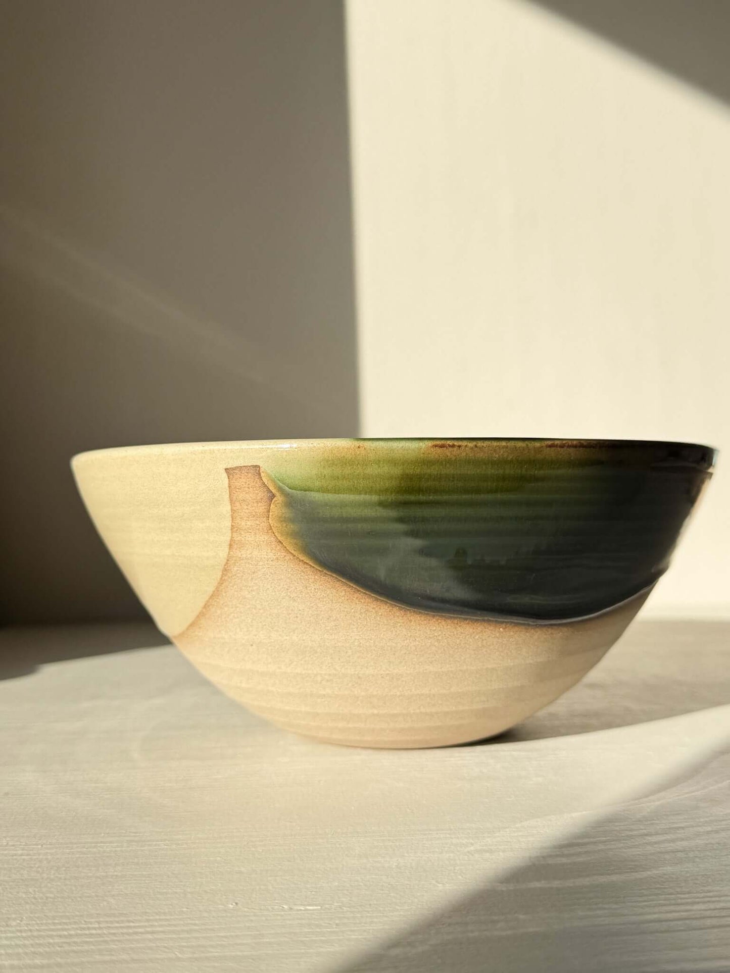 Medium Bowl - Mori #02, handmade ceramic with rich green glaze flowing into darker tones over toffee-colored clay, deep and rounded form.