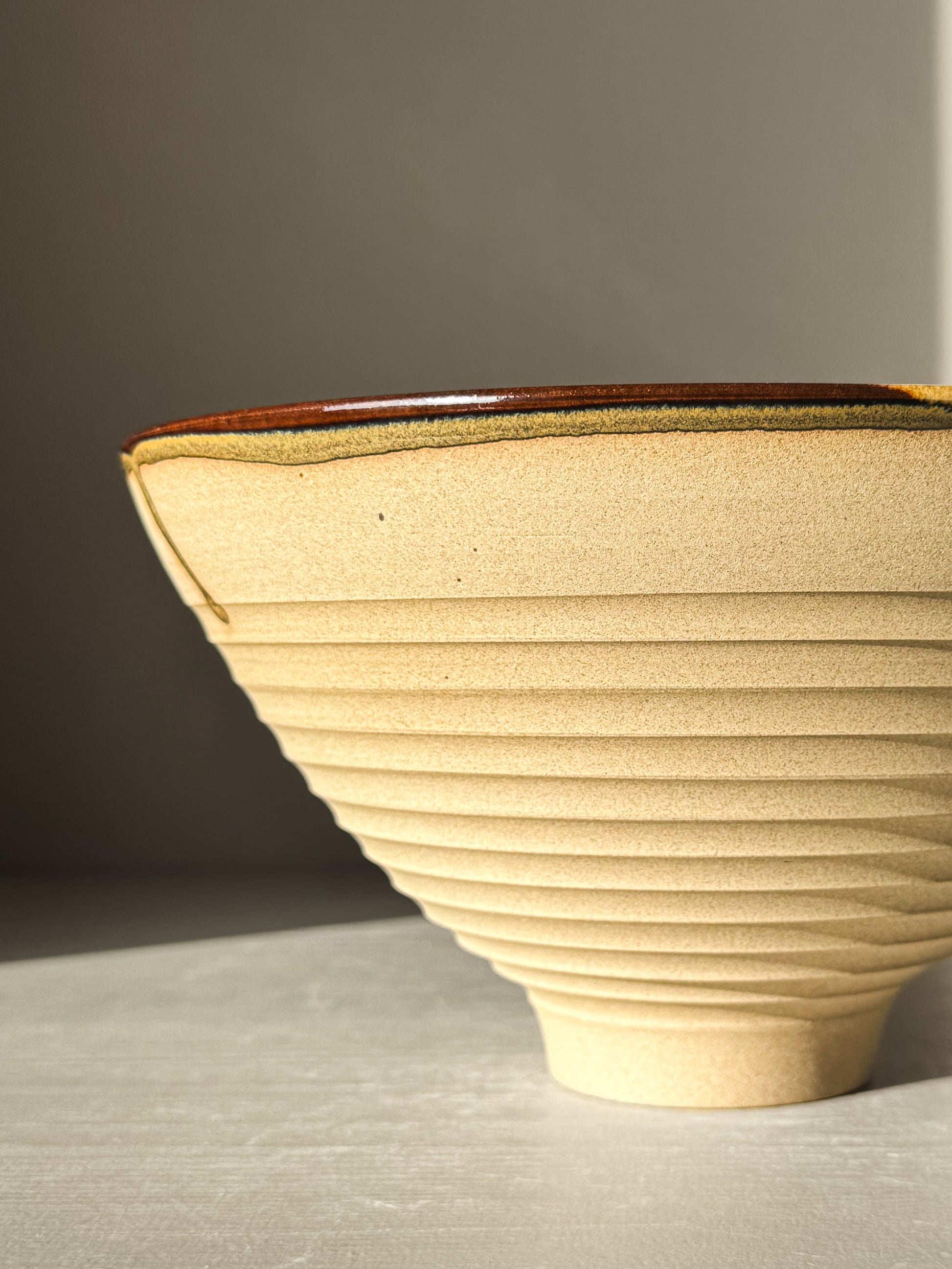 Medium Carved Bowl - Inyo #01 with textured exterior and colorful interior design.
