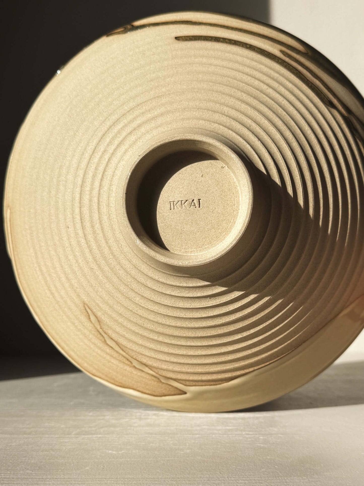 Medium Carved Bowl - Inyo #02 with sculptural carved exterior and raw clay showcasing natural flowing drips along the rim.