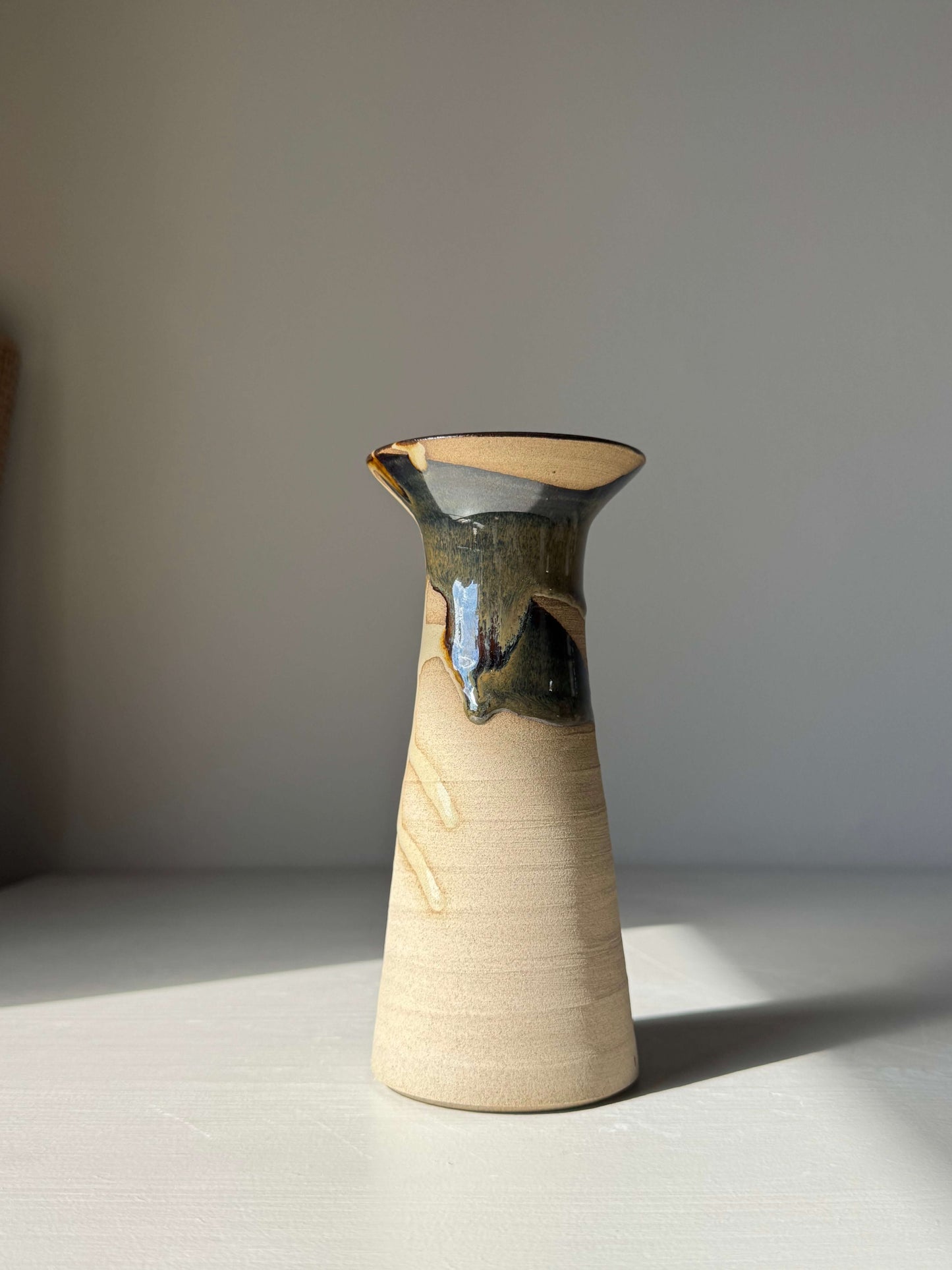 Medium Vase – Inyo Series #03 handmade ceramic with unique glaze, tall sculptural silhouette, and gently flared design on display.