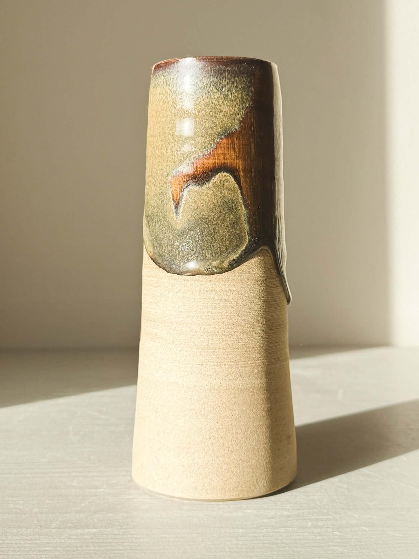 Medium Vase - Inyo Series with sculptural form, tenmoku glaze, raw texture, and unglazed clay contrasts. Tall cylinder decorative vase.