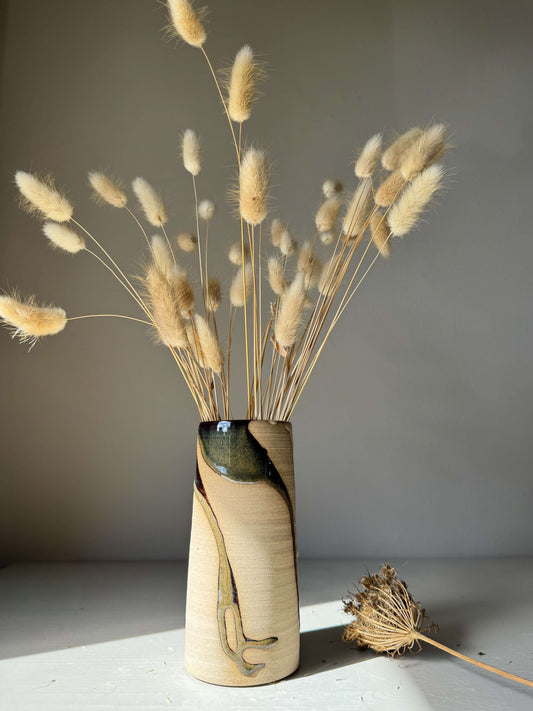 Medium Vase - Inyo Series handmade ceramic with flowing glaze and raw texture, featuring a tall cylindrical design with textured detail.