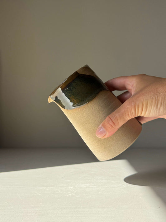 Hand holding Medium Vase / Jug – Inyo Series with raw and glazed ceramic texture, suitable for home decor or studio use.