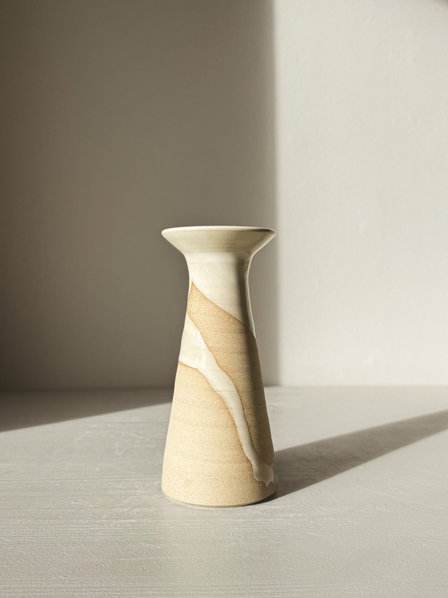 Medium Vase – Yuki #01 with glossy white glaze and natural stoneware patterns, showing a tall, softly flared silhouette on a light background.