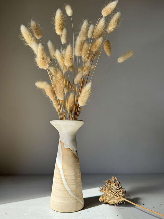 Medium Vase – Yuki #02 handmade ceramic with dried grasses, showcasing graceful white glaze flow on warm stoneware surface.