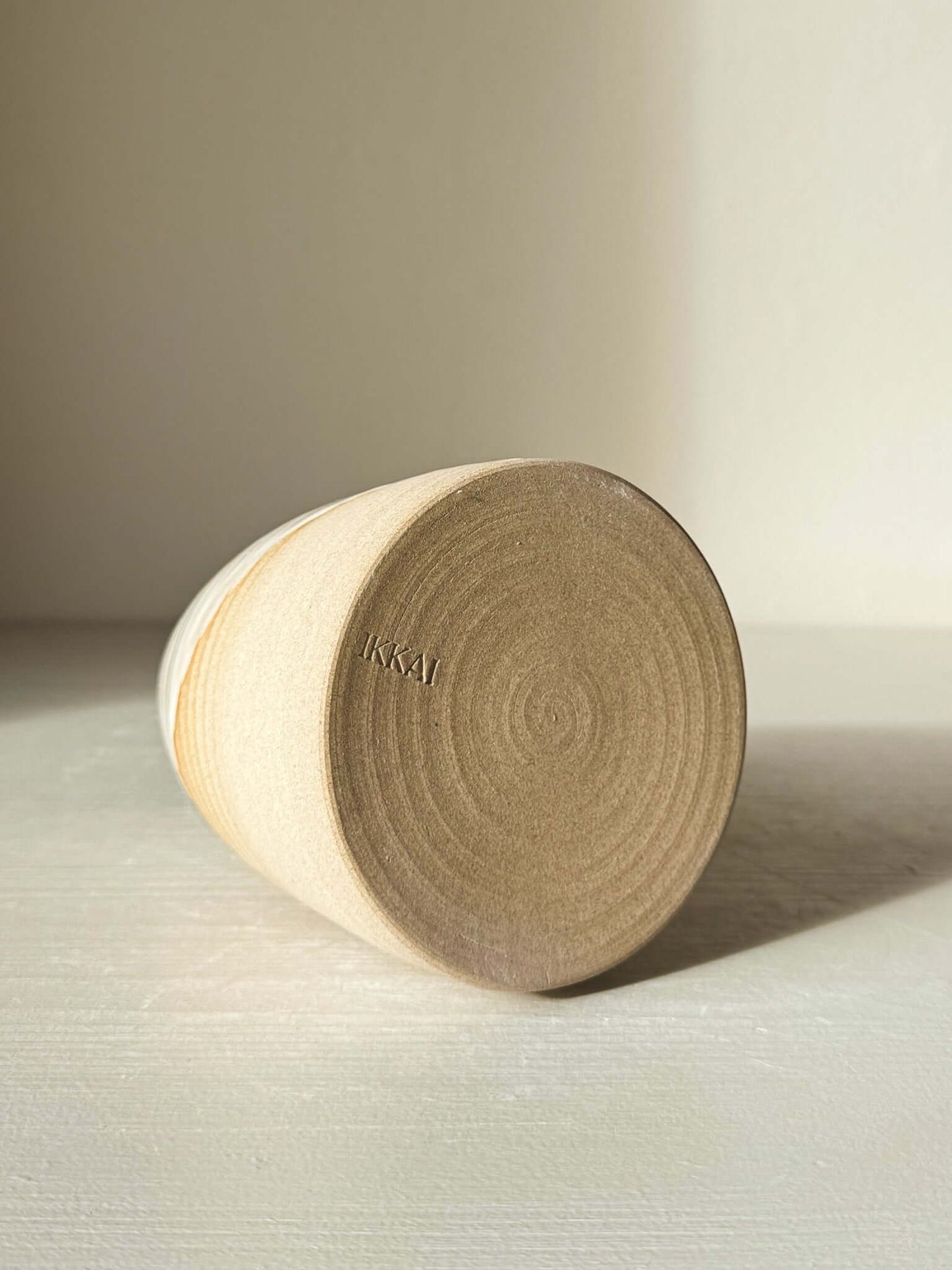 Medium Vase – Yuki #03 showing matte raw clay base with subtle texture on a flat surface.