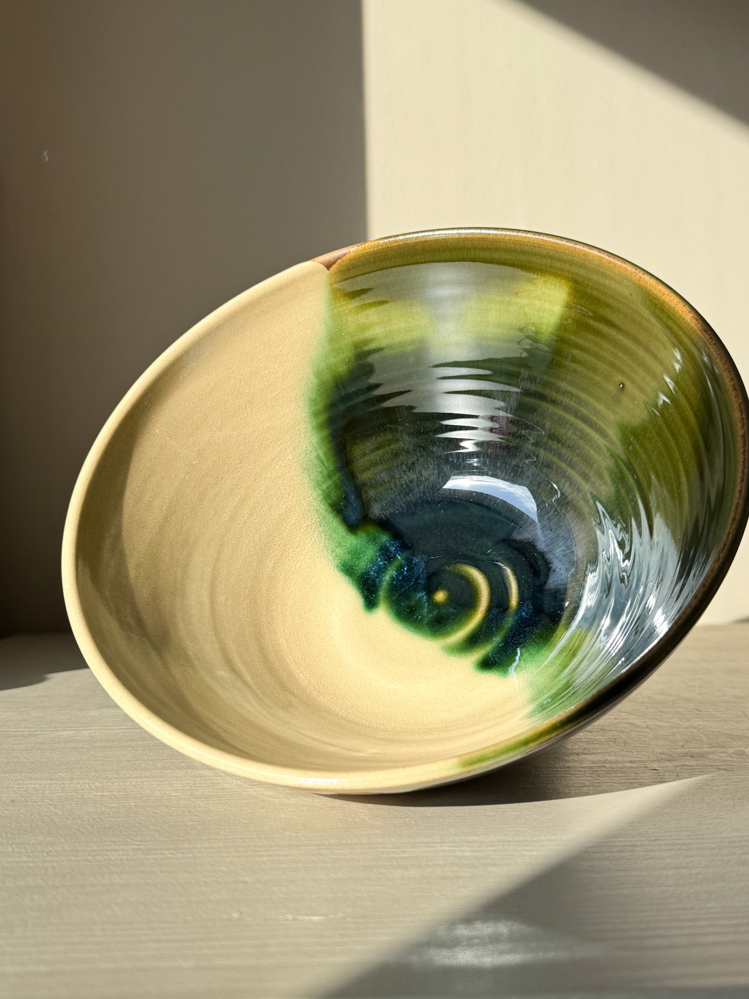 Medium Bowl - Mori #02 with a green glaze blending into toffee clay, inspired by the forest