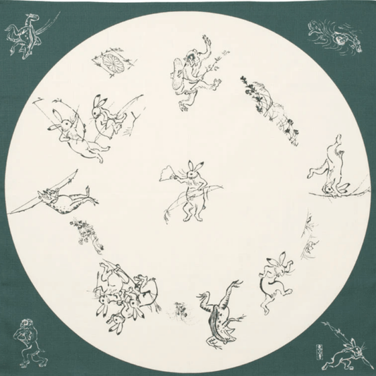Medium furoshiki with rabbits, frogs, and monkeys in a round window design on green organic cotton cloth.