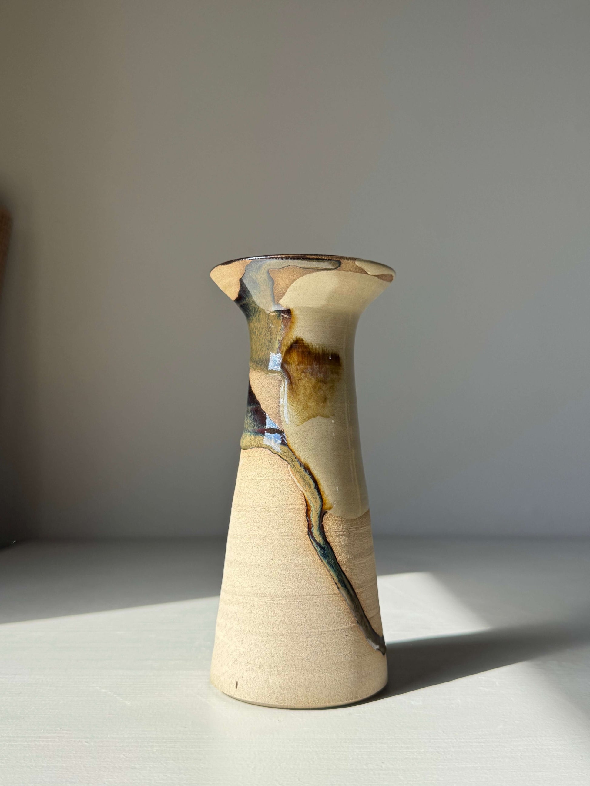 Handmade ceramic Medium Vase – Inyo Series #03 with unique glaze pattern and sculptural silhouette on a light background.
