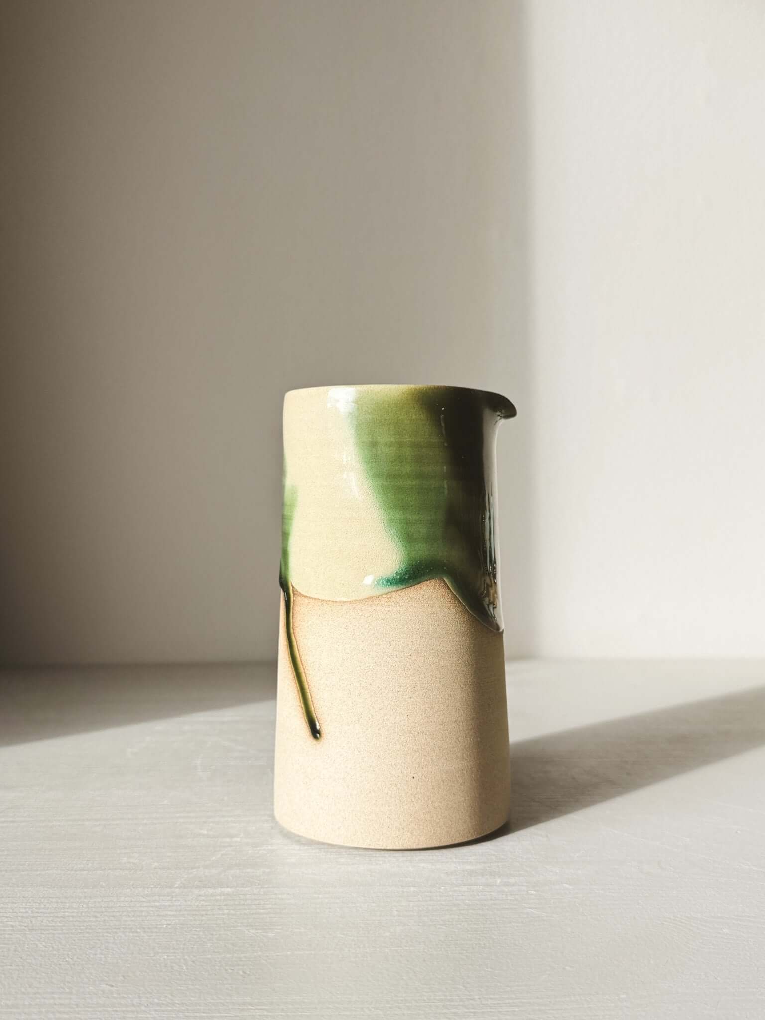 Medium Vase/Jug – Mori #01 with glossy green glaze on a warm toffee clay base, blending charm and functionality in a sculptural design.