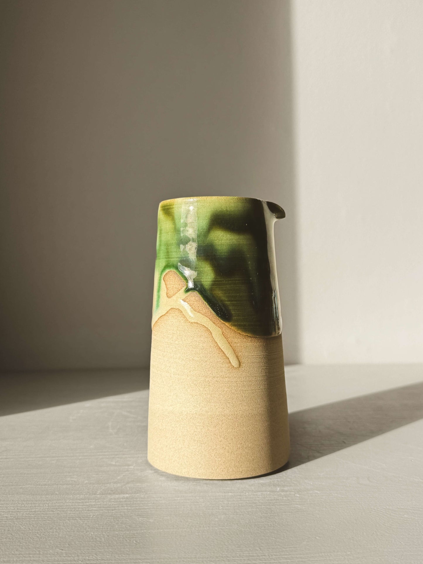 Medium Vase/Jug – Mori #02 with glossy green glaze and raw toffee clay base, perfect for adding a touch of nature to any space.