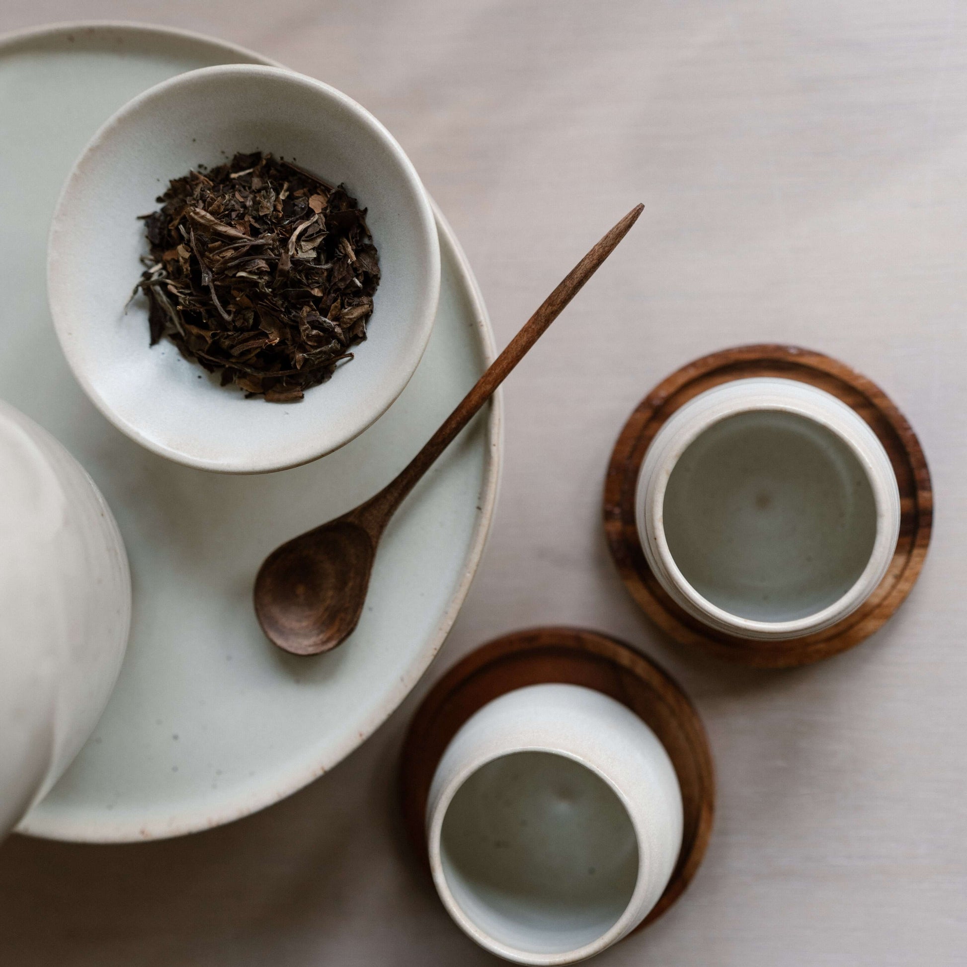 Medium Walnut Wooden Spoons with handmade ceramic cups and saucers