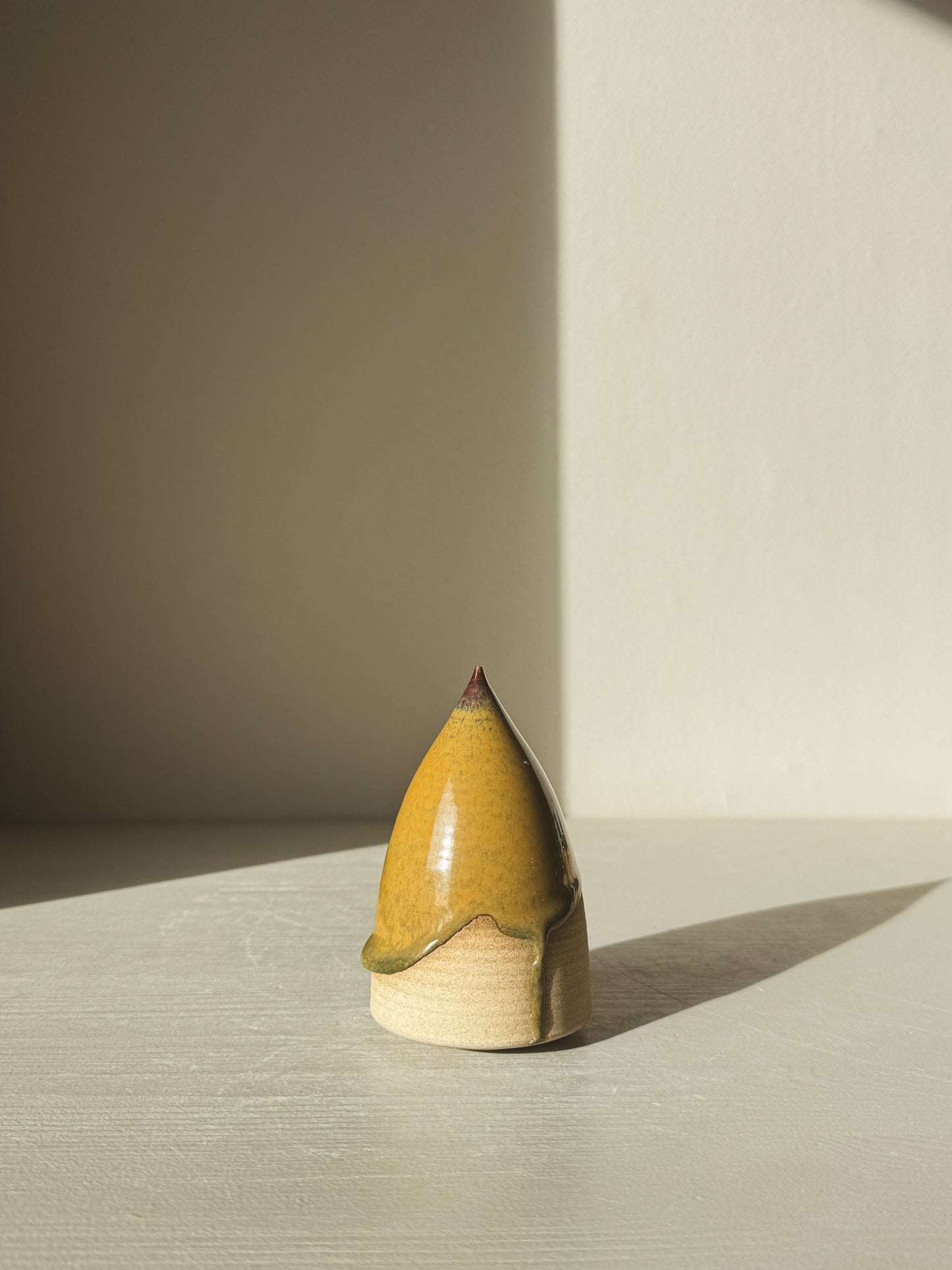 Minimalist Ceramic Christmas Tree – Inyo #03 with Tenmoku glaze in warm tones.