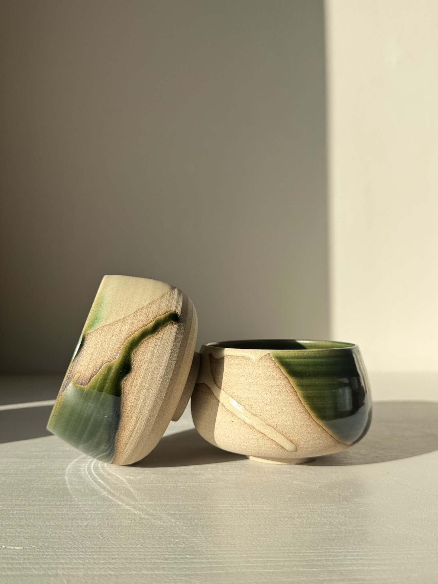 Coffee cups - Mori with green glaze on toffee clay, featuring a rounded design and artistic movement, ideal for daily use and peaceful moments.