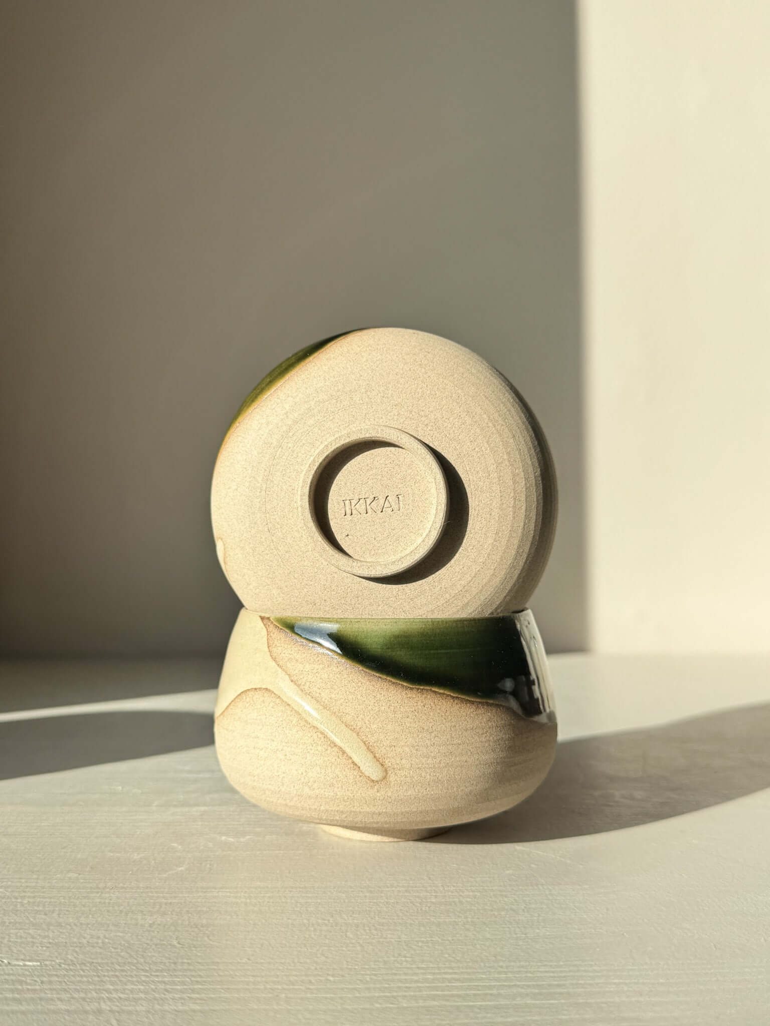 Coffee Cups - Mori on display, showcasing green glaze over toffee clay and deep blue interior, perfect for daily use and mindful pauses.