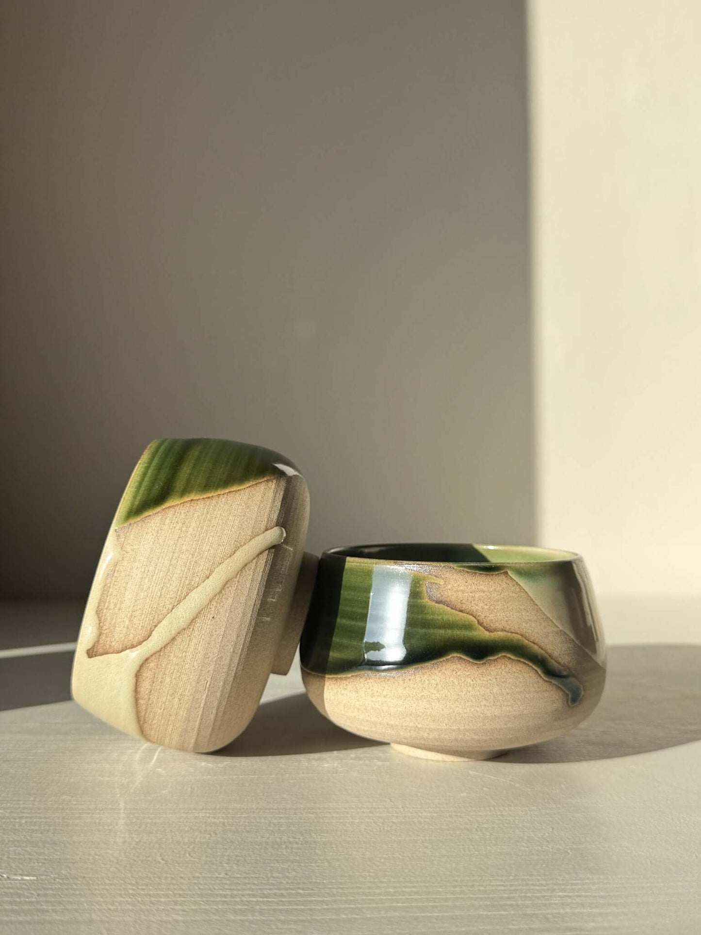 Coffee cups - Mori with green glaze over toffee clay, capturing forest movement and deep blue pools, for daily use and calming moments.