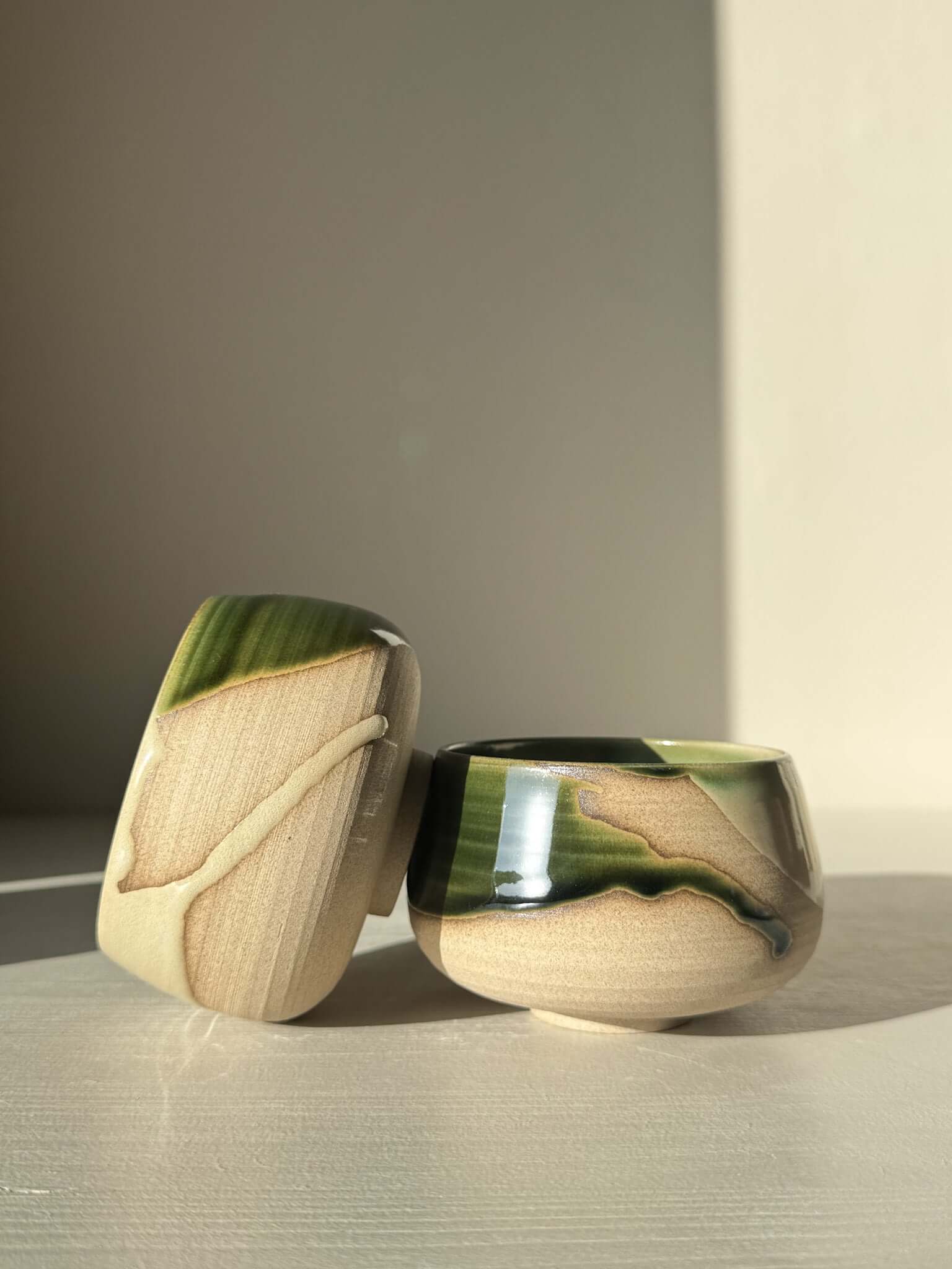 Coffee cups - Mori with green glaze over toffee clay, capturing forest movement and deep blue pools, for daily use and calming moments.