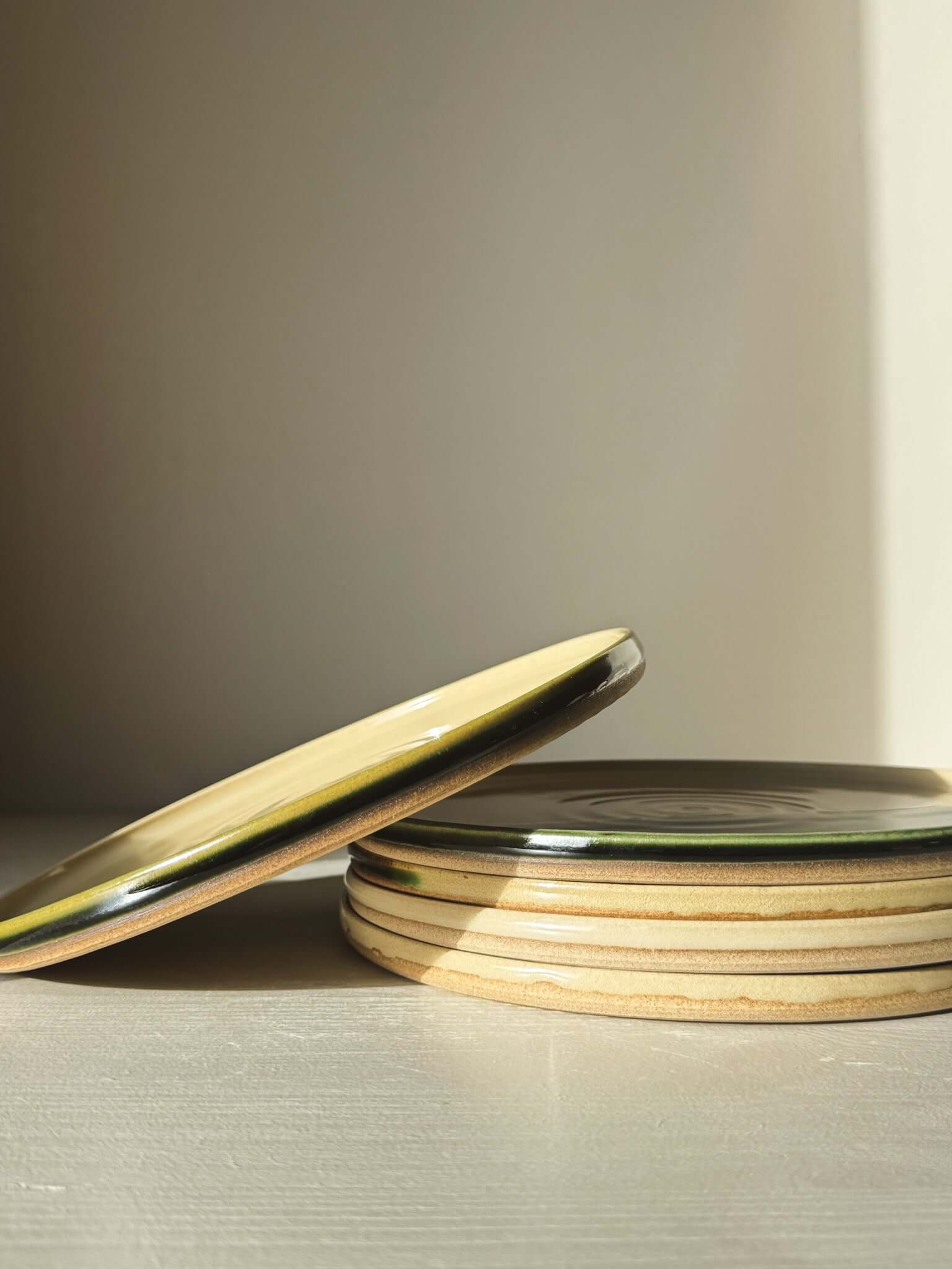 Flat Round Breakfast Plate – Mori with natural glaze and toffee clay tones, stacked beautifully, capturing forest-inspired aesthetics.