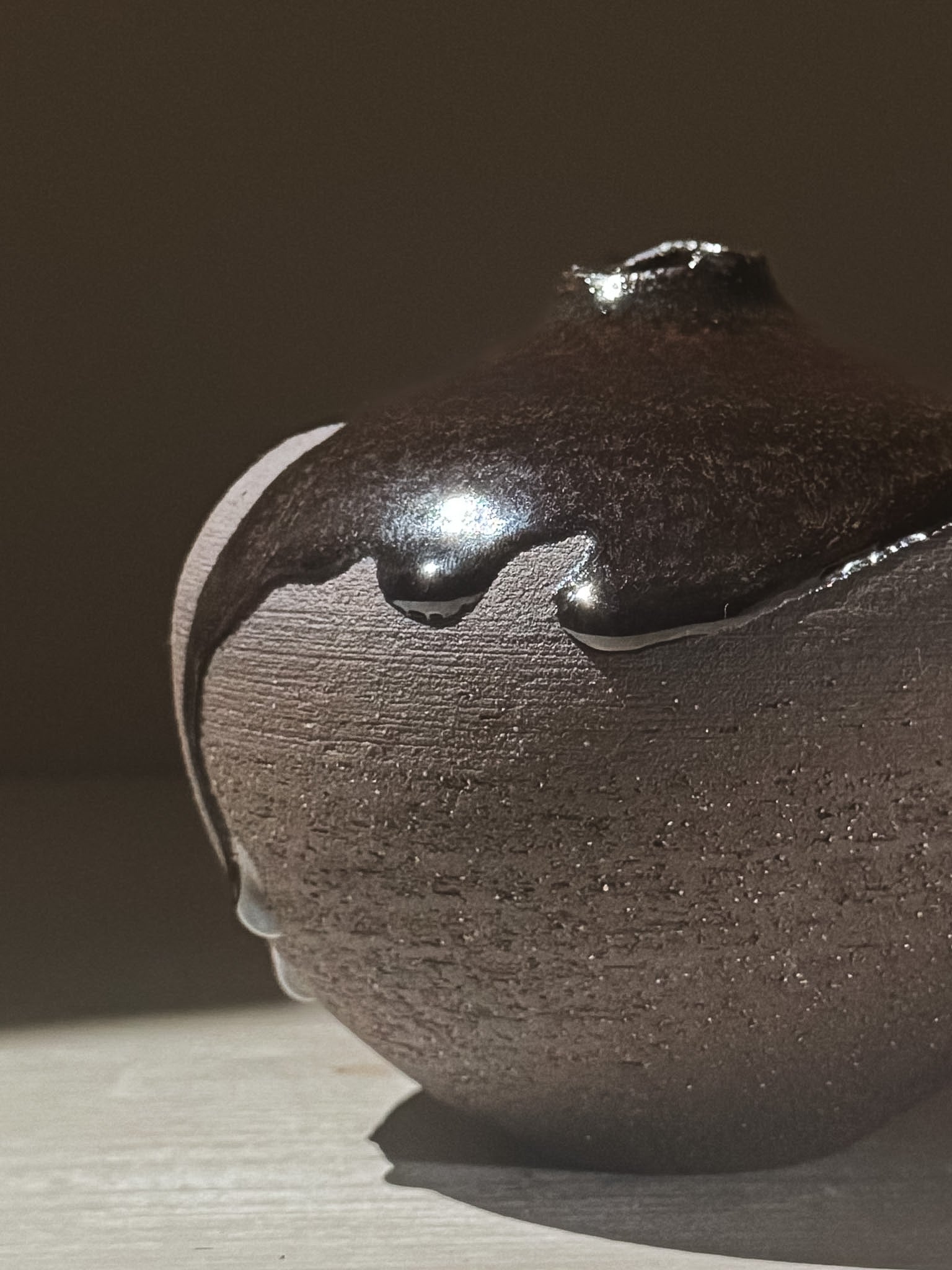 Orb Vase – Kuro Black #02 featuring a unique glaze with organic drips and rounded form.