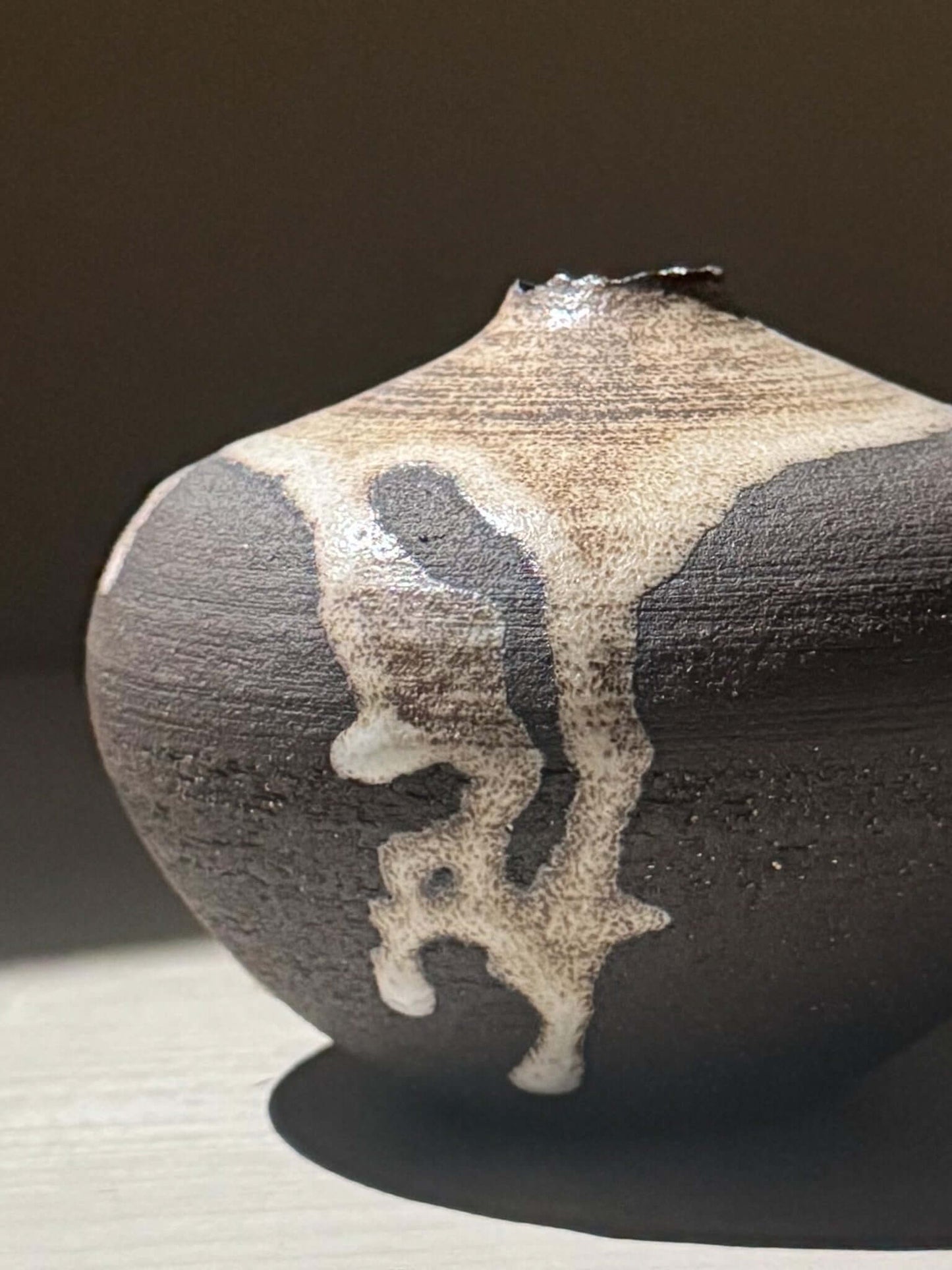 Orb Vase – Matt Clear showcasing unique glaze movement and organic patterns in a soft spherical form.