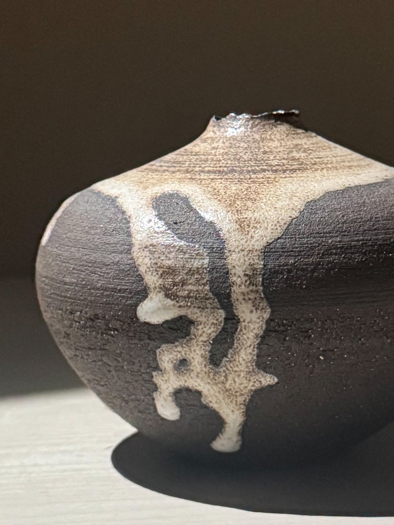 Orb Vase – Matt Clear showcasing unique glaze movement and organic patterns in a soft spherical form.