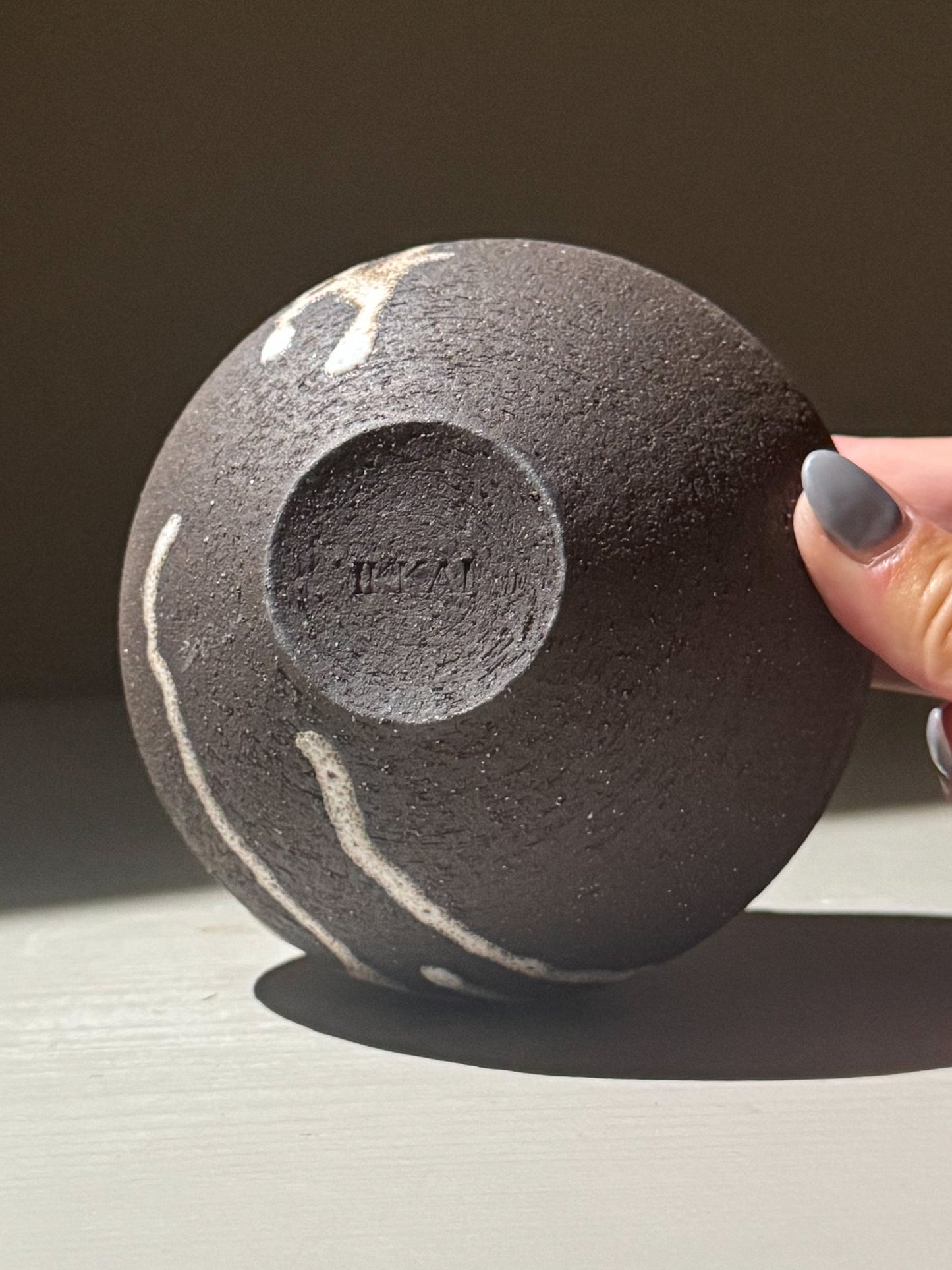 Orb Vase – Matt Clear shown in a close-up view, highlighting its textured surface and unique glaze patterns.