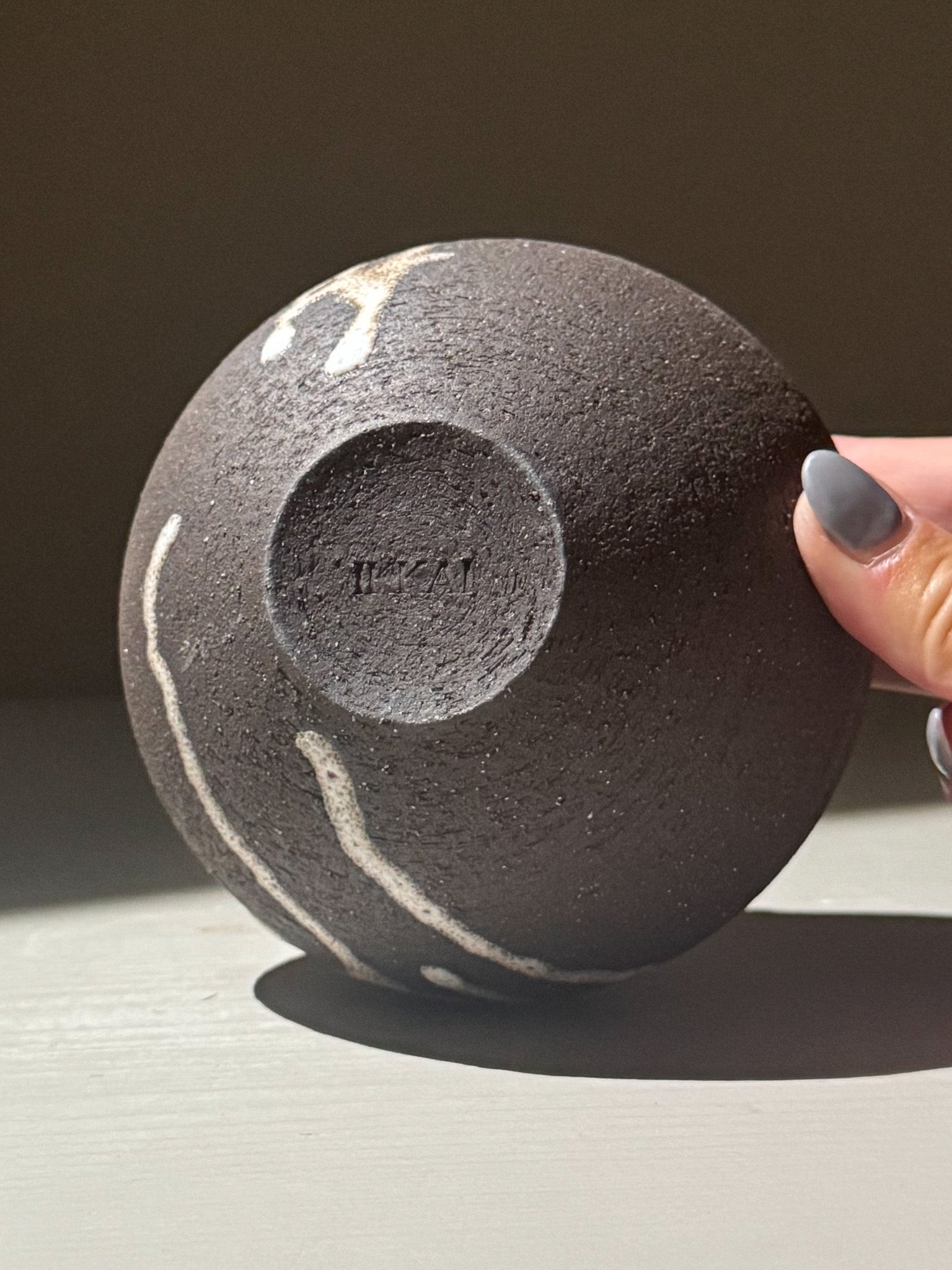 Orb Vase – Matt Clear shown in a close-up view, highlighting its textured surface and unique glaze patterns.