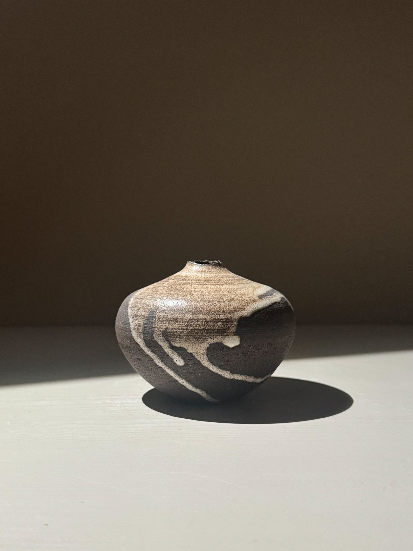 Orb Vase – Matt Clear with organic patterns and soft spherical form, showcasing unique glaze movement.
