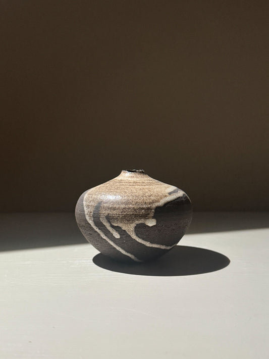 Orb Vase – Matt Clear with organic patterns and soft spherical form, showcasing unique glaze movement.