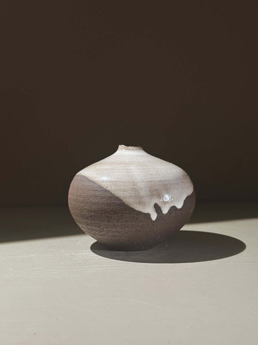 Orb Vase – Yuki Black #03, a unique spherical vase with gentle glaze drips and organic patterns.