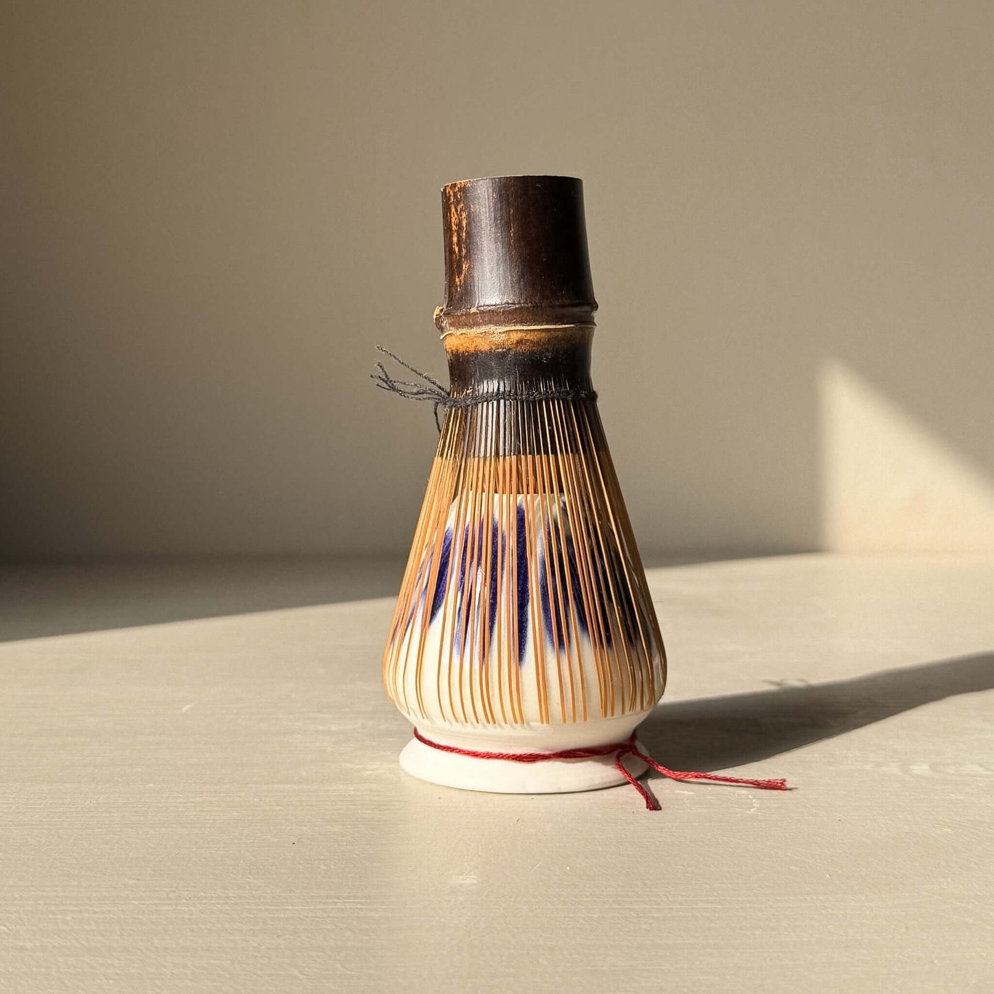 Porcelain Whisk Holder – Cobalt & Gold Lustre showcasing a bamboo whisk holder with expressive cobalt blue details.