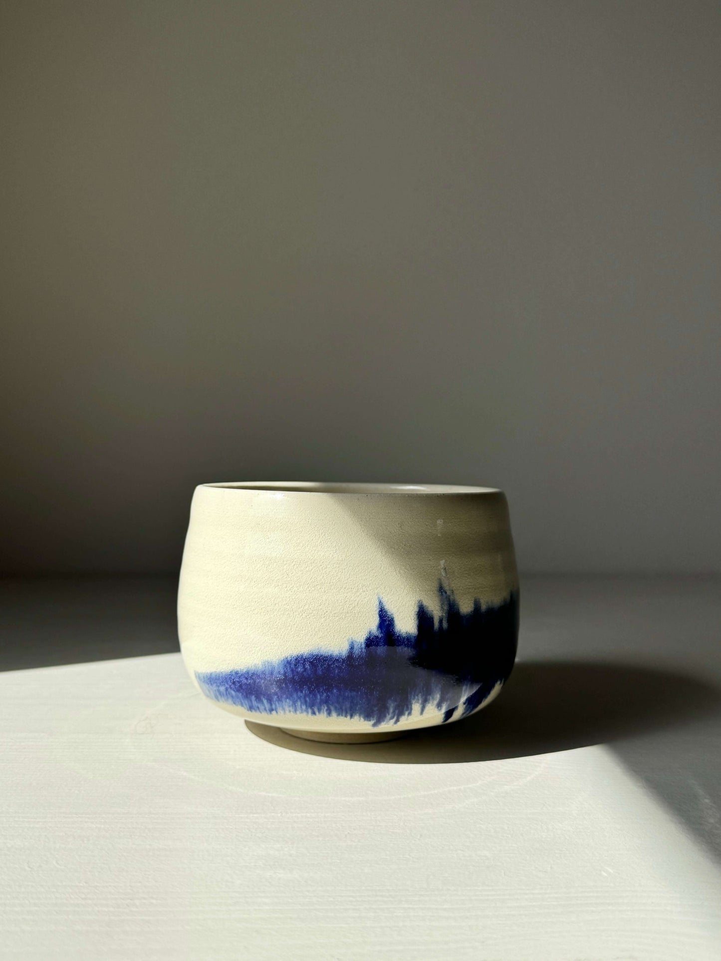 Rounded Matcha Bowl with cobalt glaze design from Gosu Series, featuring deep blue patterns resembling distant landscapes.