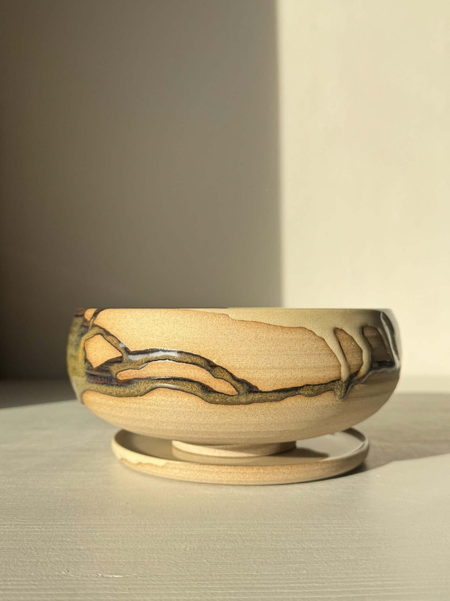 Rounded Berry Bowl - Inyo #02 with a drip plate, in earthy tones, ideal for serving fresh fruits, crafted with glossy tenmoku glaze.