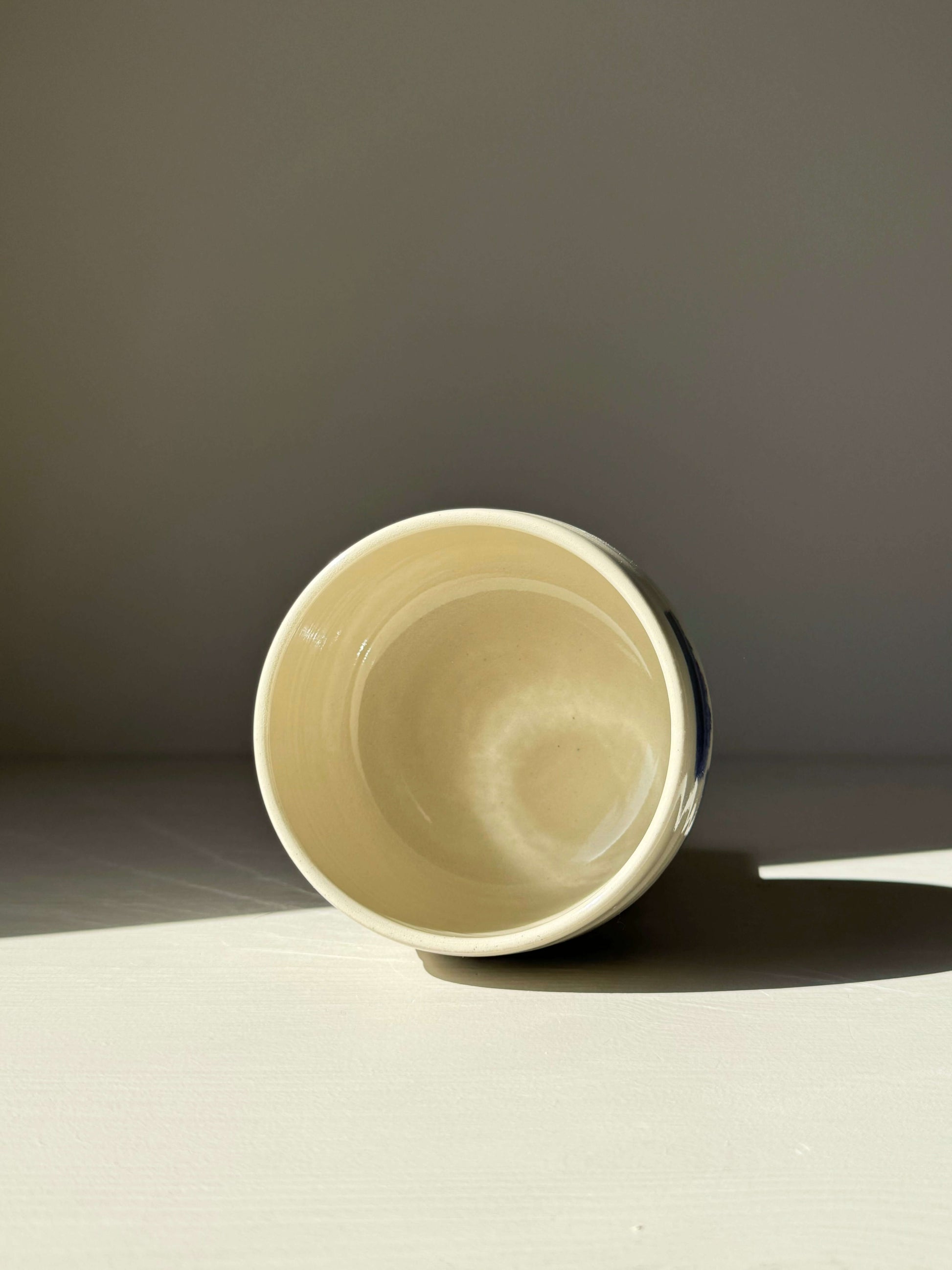 Interior view of Rounded Matcha Bowl from Gosu Series with cobalt glaze, highlighting its smooth curves and artistic design.