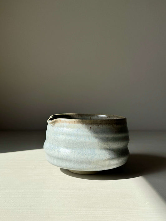 Sky blue glazed matcha bowl with spout and ridged shape, perfect for whisking. Unique, calming design in serene, natural tones.