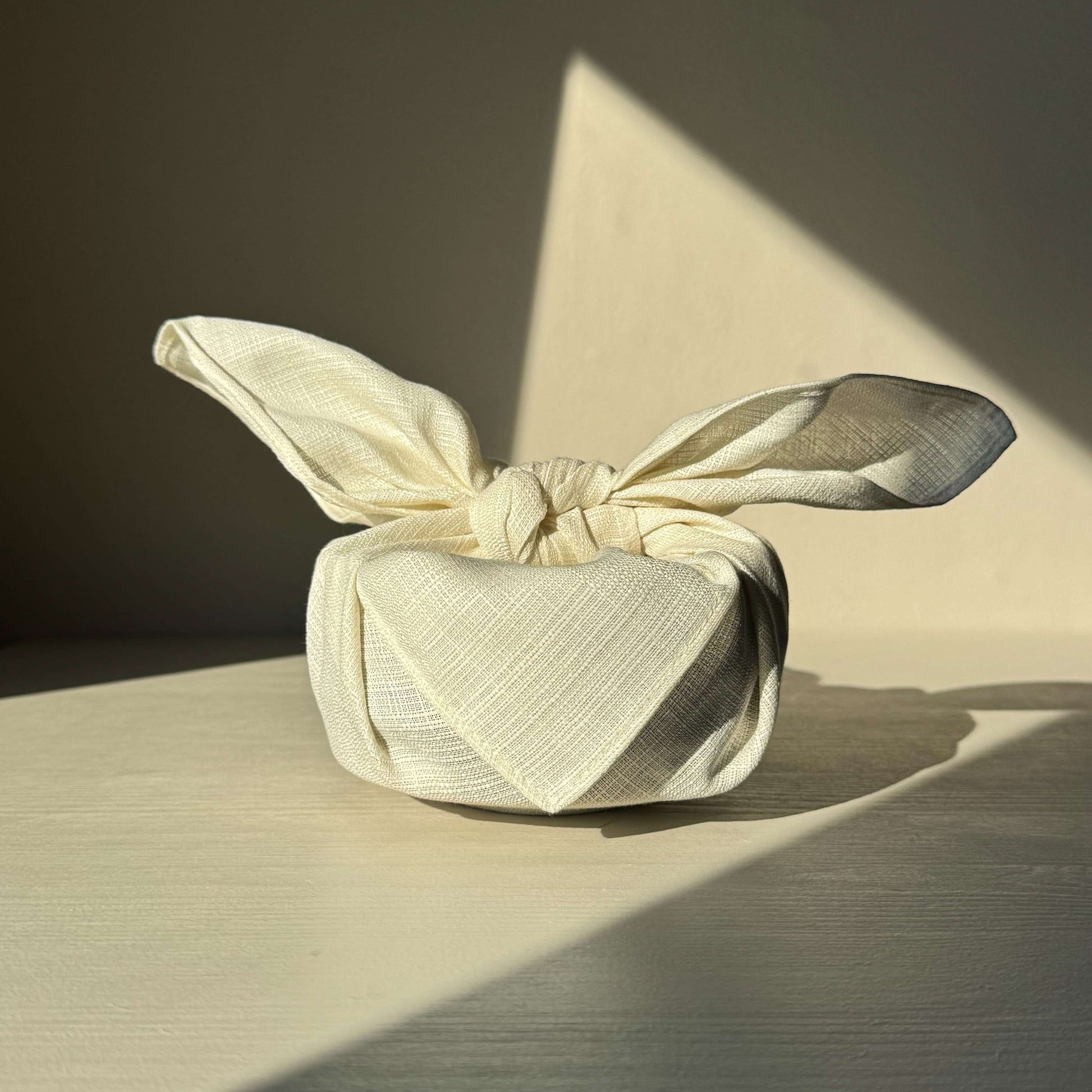 Small Plain Ecru Furoshiki Wrap in Organic Cotton, 48x48 cm. Elegant and sustainable gift wrapping solution.