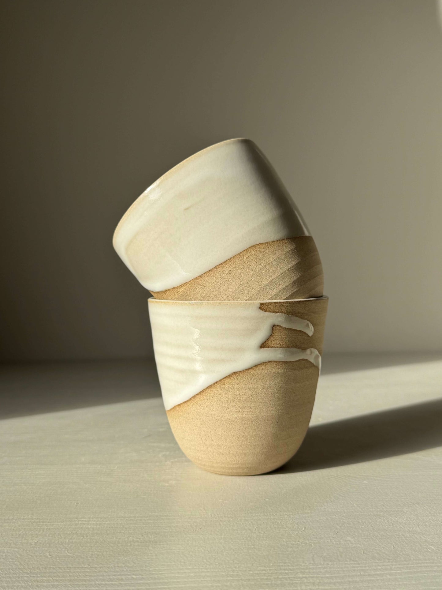 Stackable Latte Cups - Yuki handmade ceramic with white glaze and toffee clay, showcasing stackable design and artisanal craftsmanship.