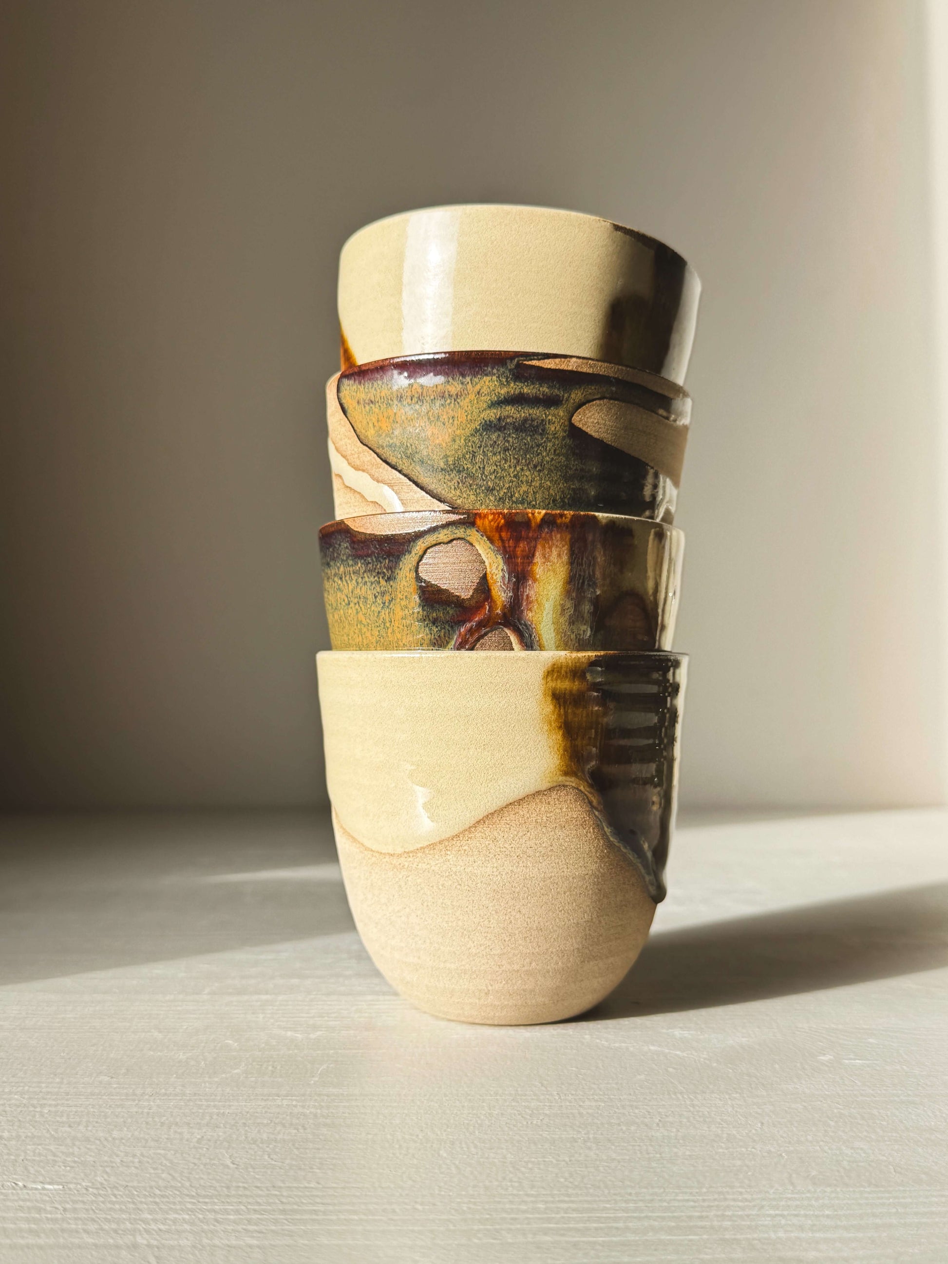 Stackable Latte Cups - Inyo with glossy tenmoku and clear glaze, showcasing handmade wheel-thrown craftsmanship.