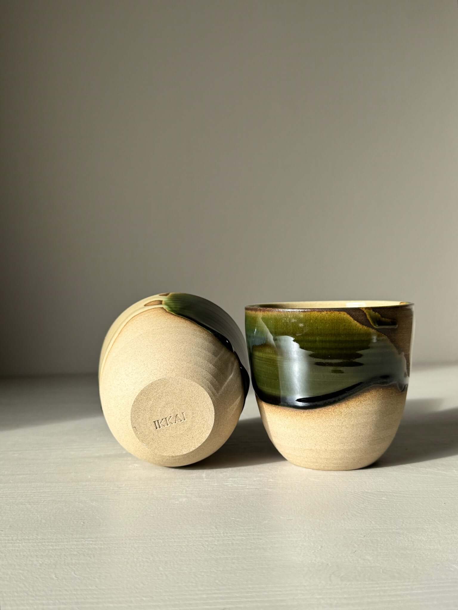 Stackable Latte Cups - Mori with half glossy green and clear glaze over wheel-thrown stoneware, displayed on a light surface