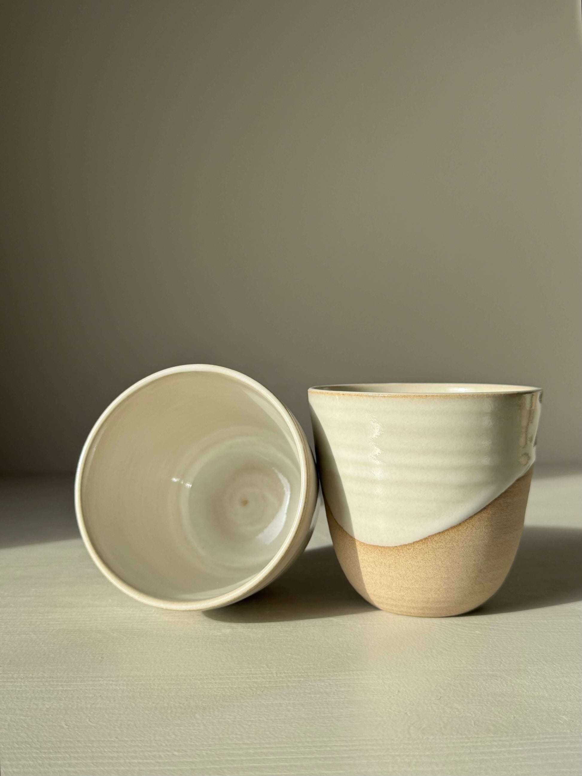 Handmade ceramic Stackable Latte Cups - Yuki with glossy white glaze and warm toffee clay, showcasing unique handmade craftsmanship.
