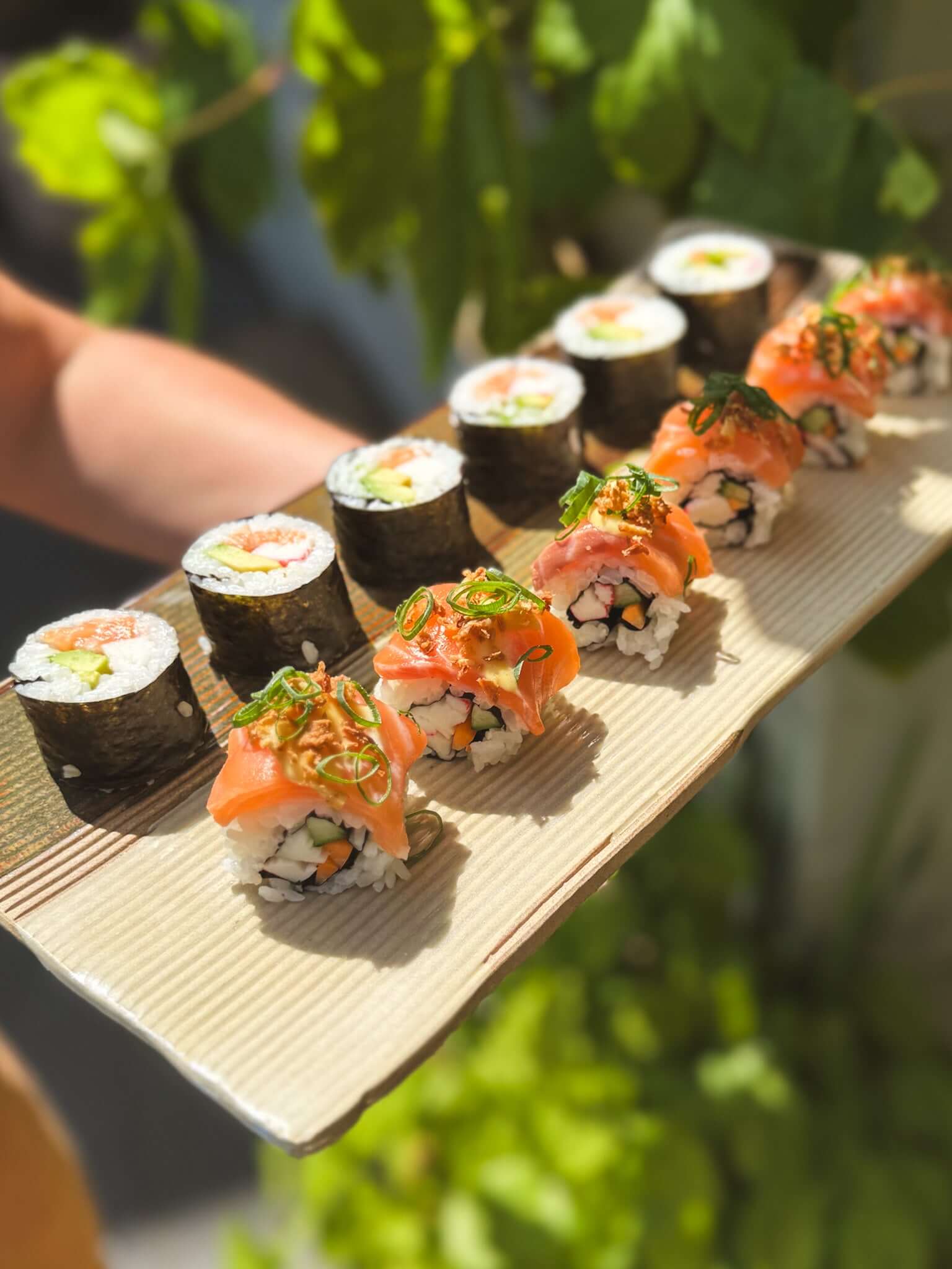 Sushi Plate – Inyo Series #02 with assorted sushi rolls, handmade ceramic, showcasing its structured form and unique glaze texture.