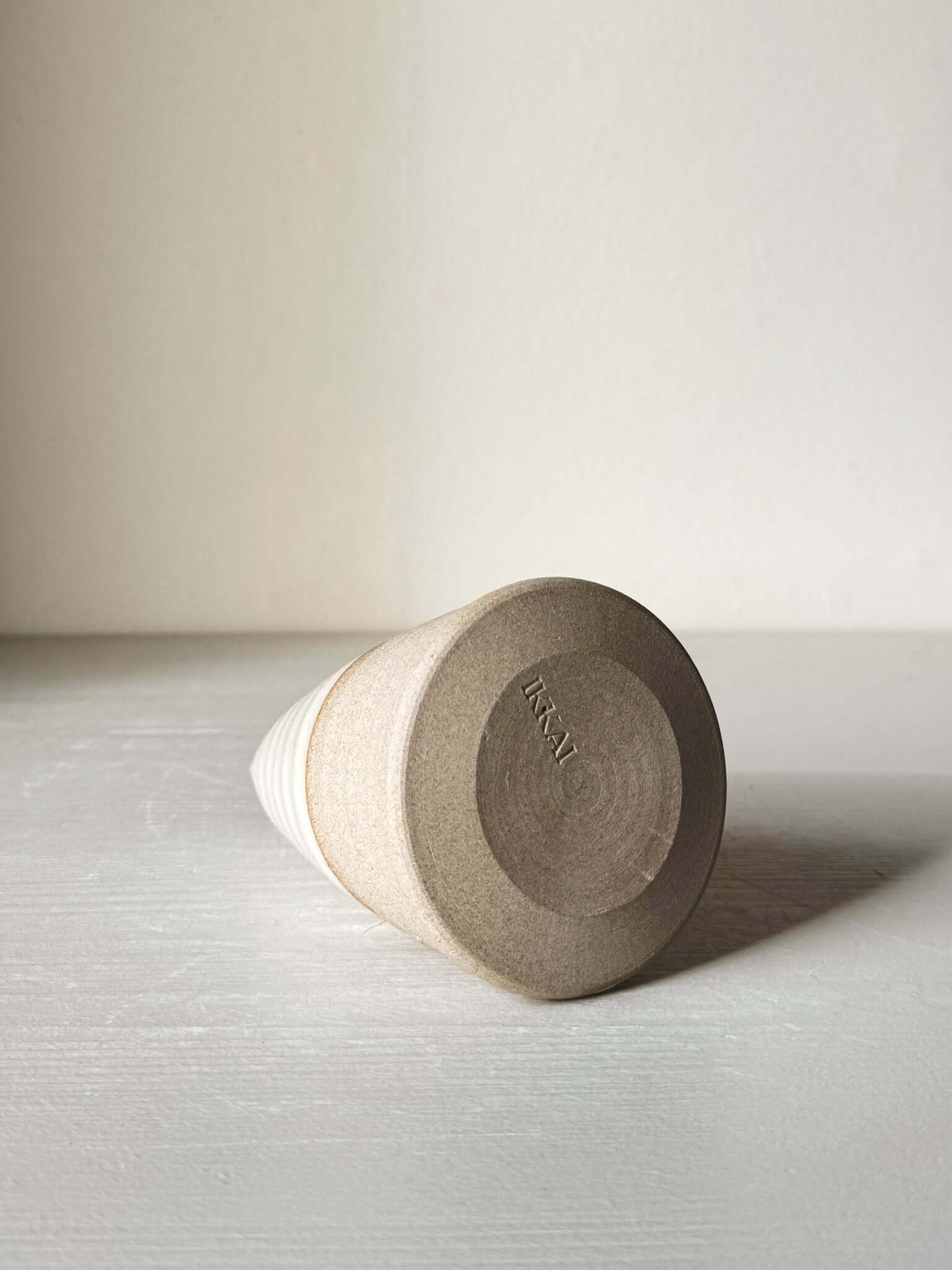 Base view of Textured Ceramic Tree – Yuki #03, showcasing the natural clay finish and artist's mark on a minimalist surface.