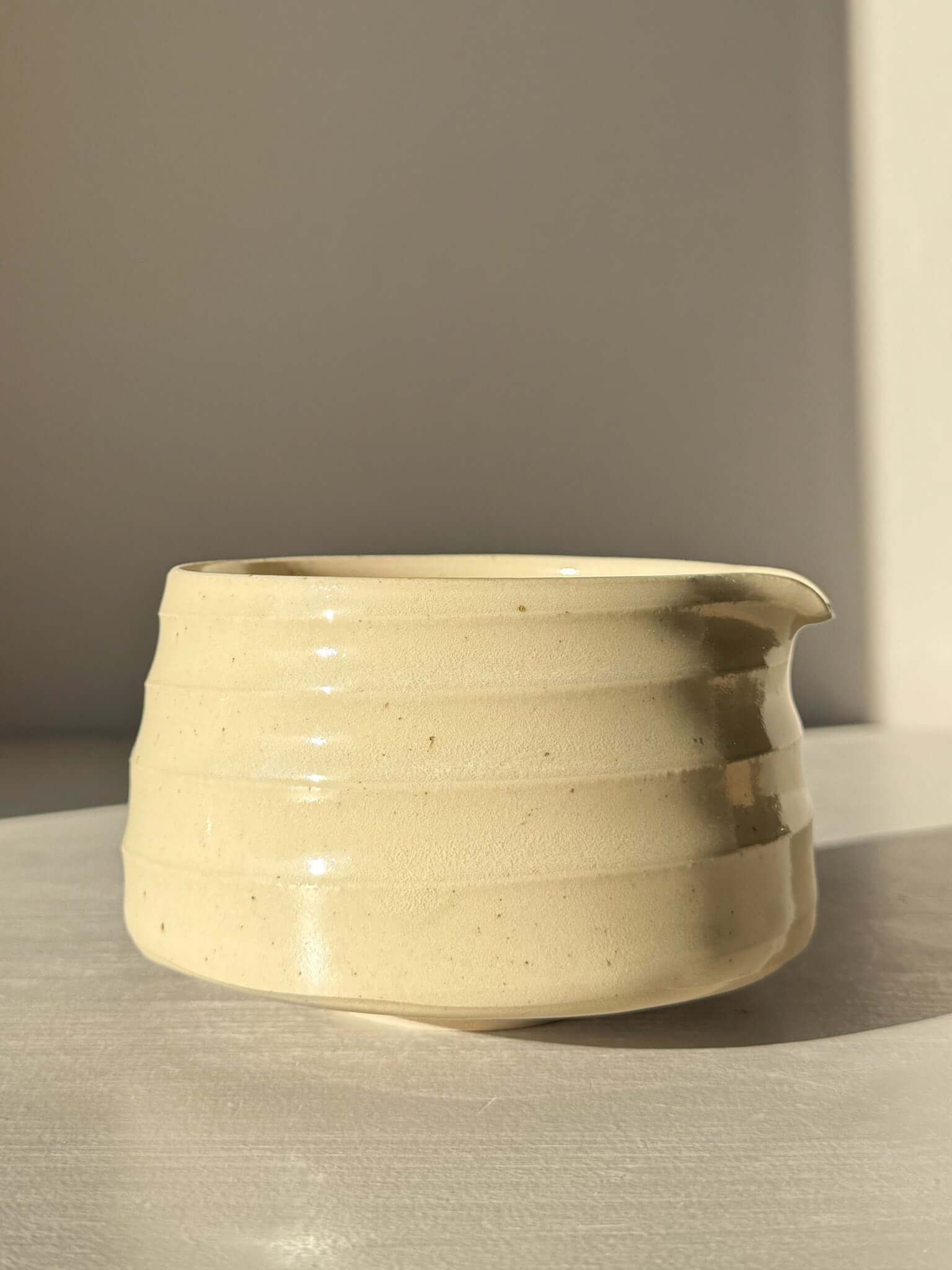 Textured Matcha Bowl Spout - Clear #02 with glossy glaze highlighting stoneware texture and pouring spout for easy serving.
