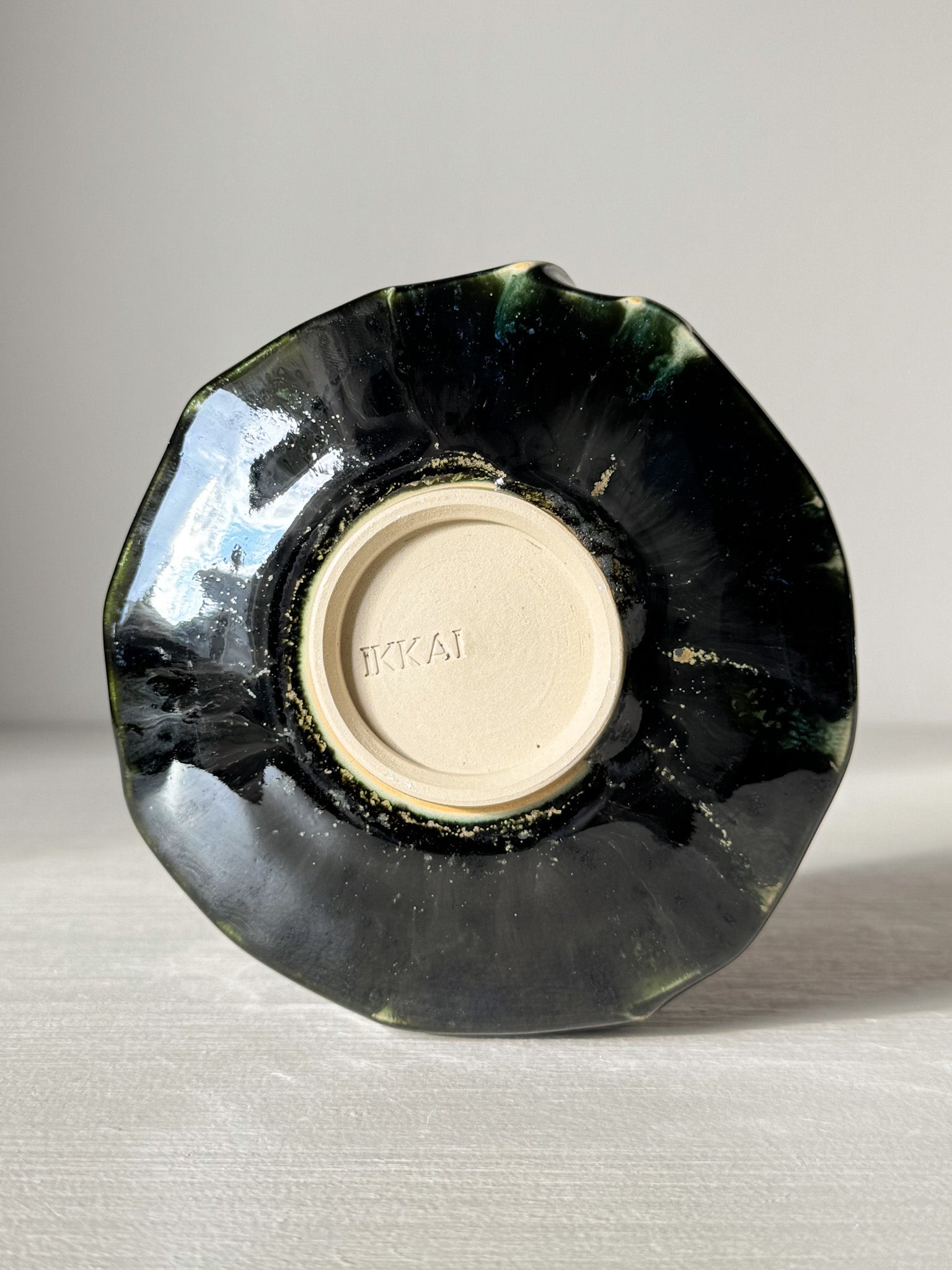 Bottom view of Textured Matcha Bowl - Hinoki #04 with green glaze and unique texture from Hinoki Series.