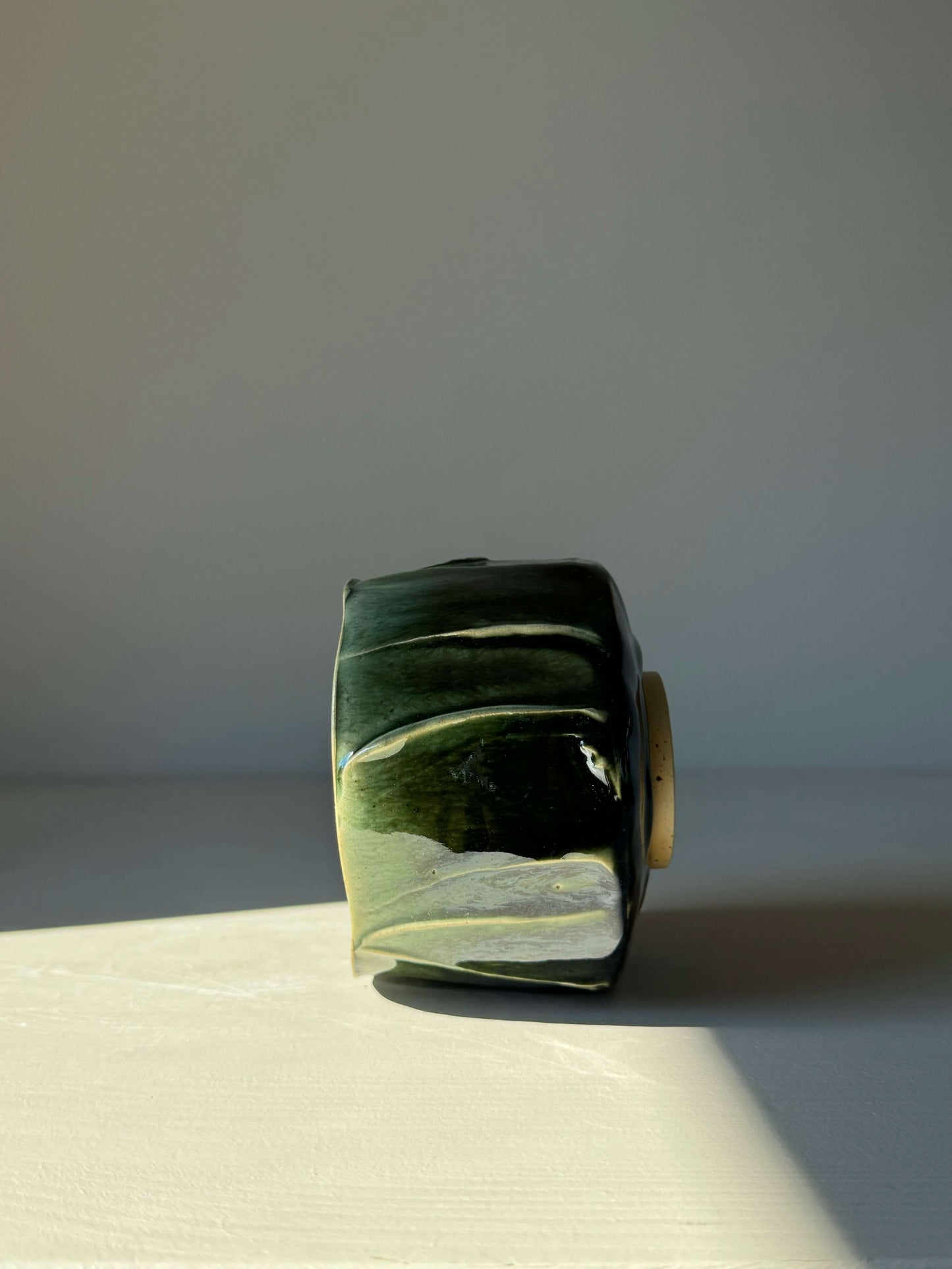 Side view of Textured Matcha Bowl from the Hinoki Series, featuring a green glaze and unique texture, inspired by Hinoki tree hues.