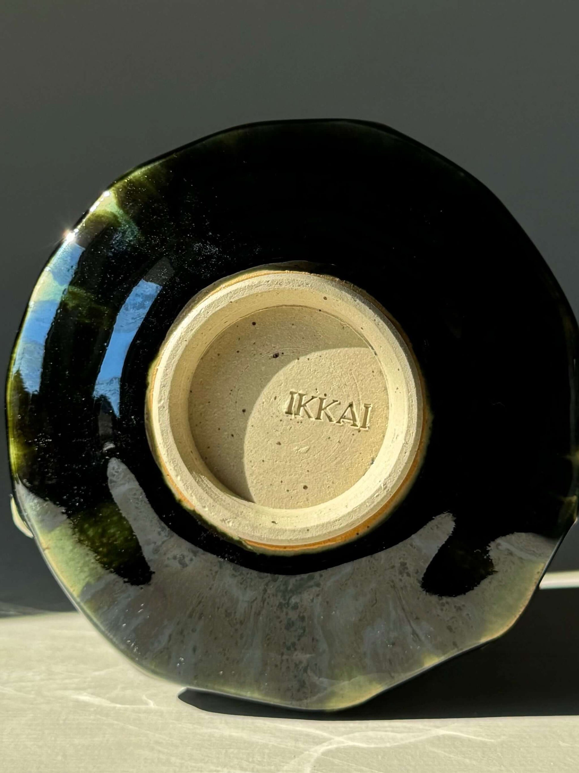 Bottom view of Textured Matcha Bowl from Hinoki Series showing unique green glaze and textured design.