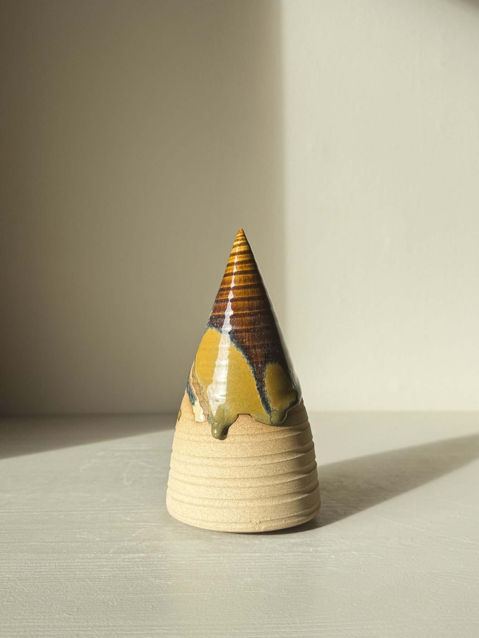 Textured Ceramic Tree – Inyo #02 with deep brown tenmoku glaze in sunlight, showcasing handmade texture and natural throwing lines.