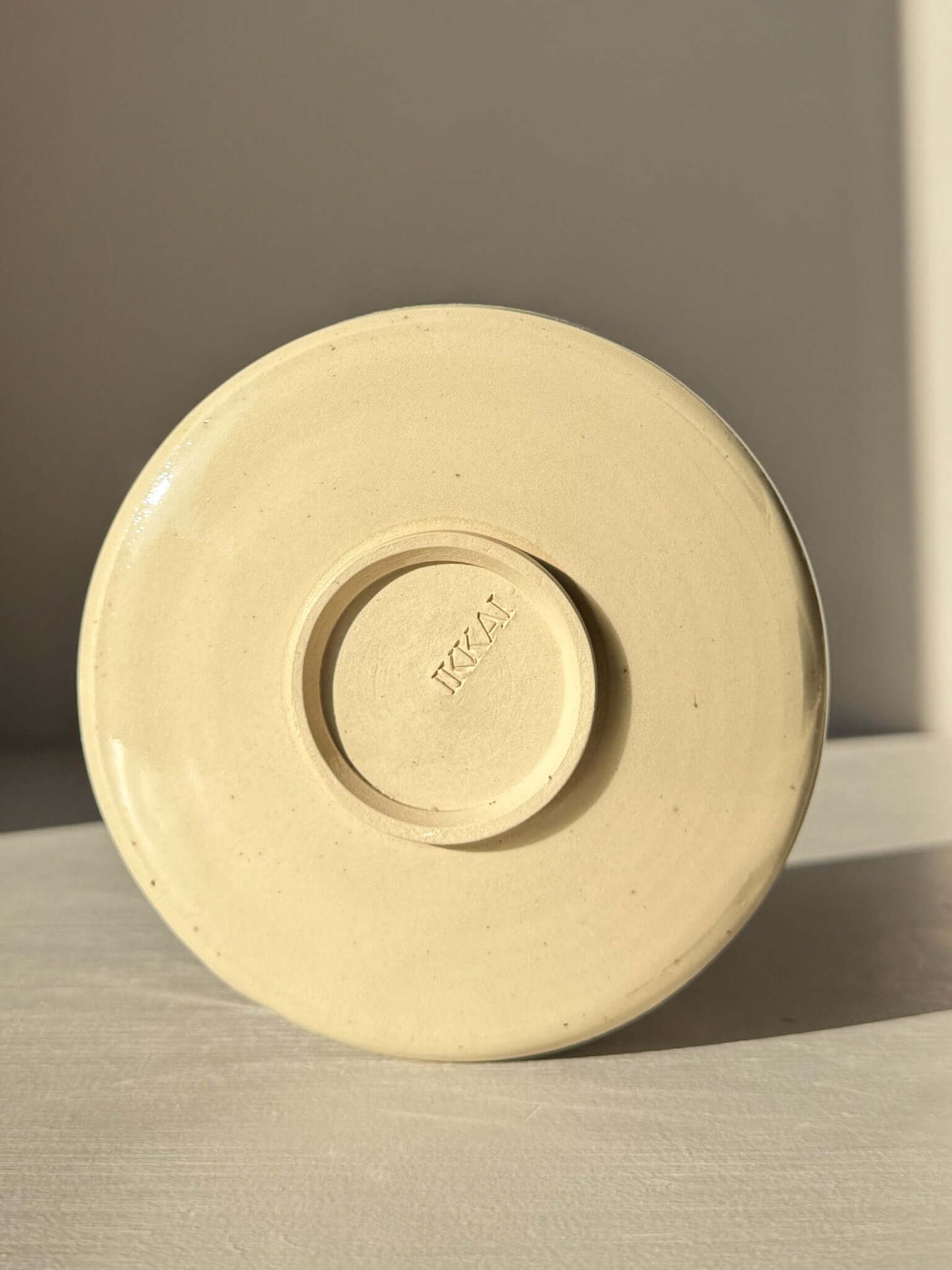 Bottom view of Textured Matcha Bowl Spout - Clear #02 showing stoneware and maker's mark