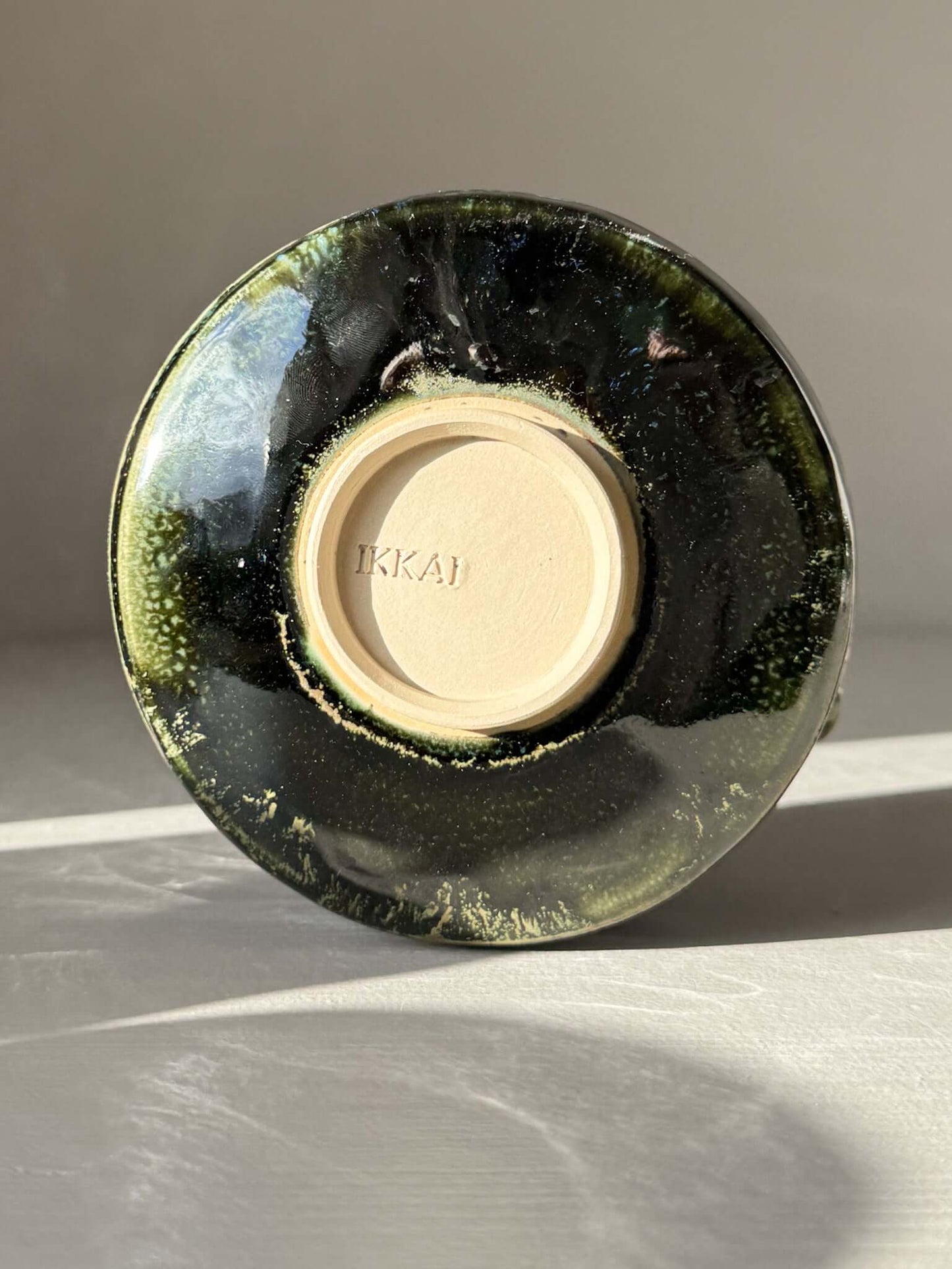 Underside of Textured Matcha Bowl Spout - Hinoki #03 with glossy green glaze